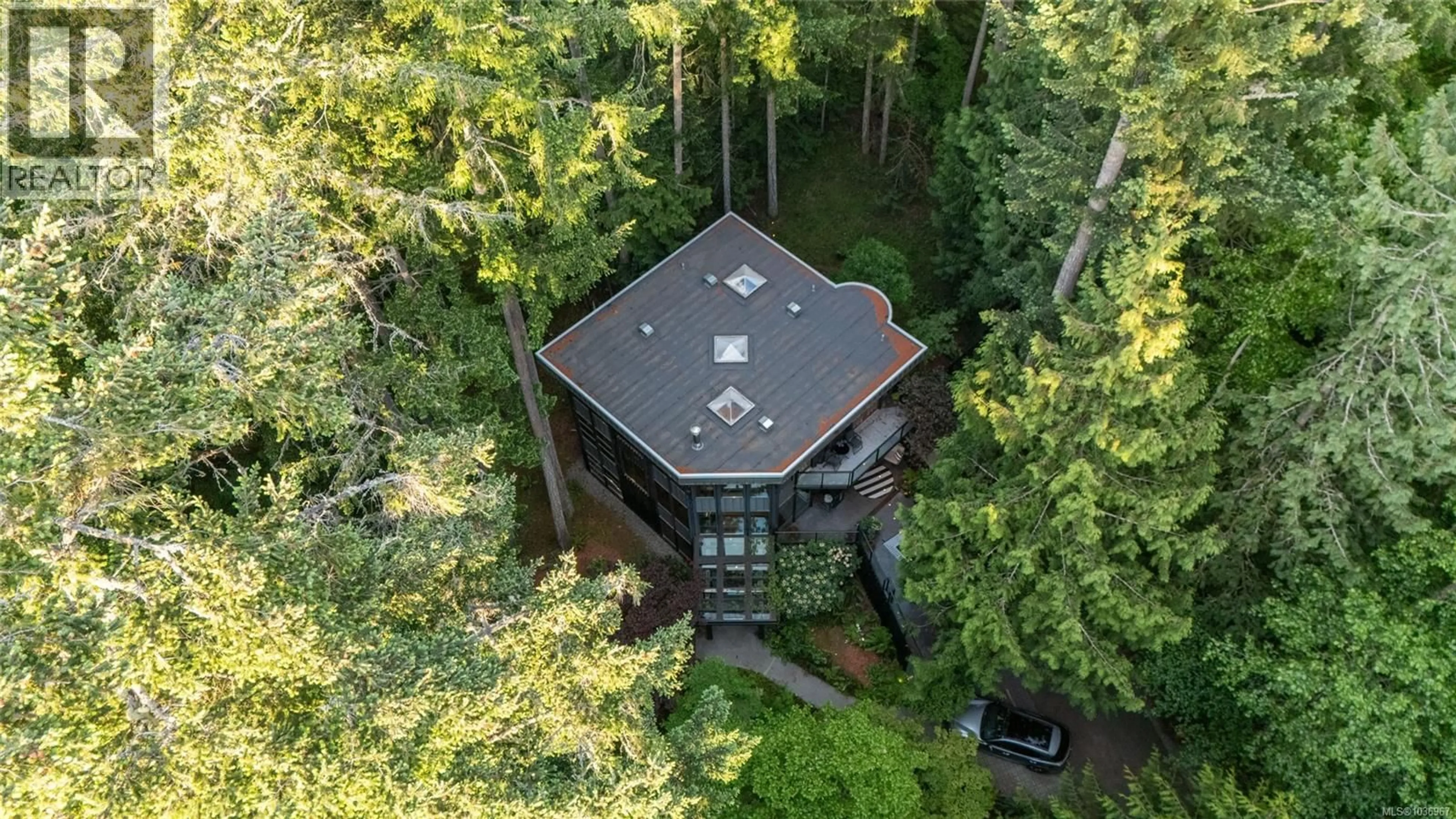 A pic from outside/outdoor area/front of a property/back of a property/a pic from drone, forest/trees view for 1457 HOWCREST ROAD, North Saanich British Columbia V8L5K1