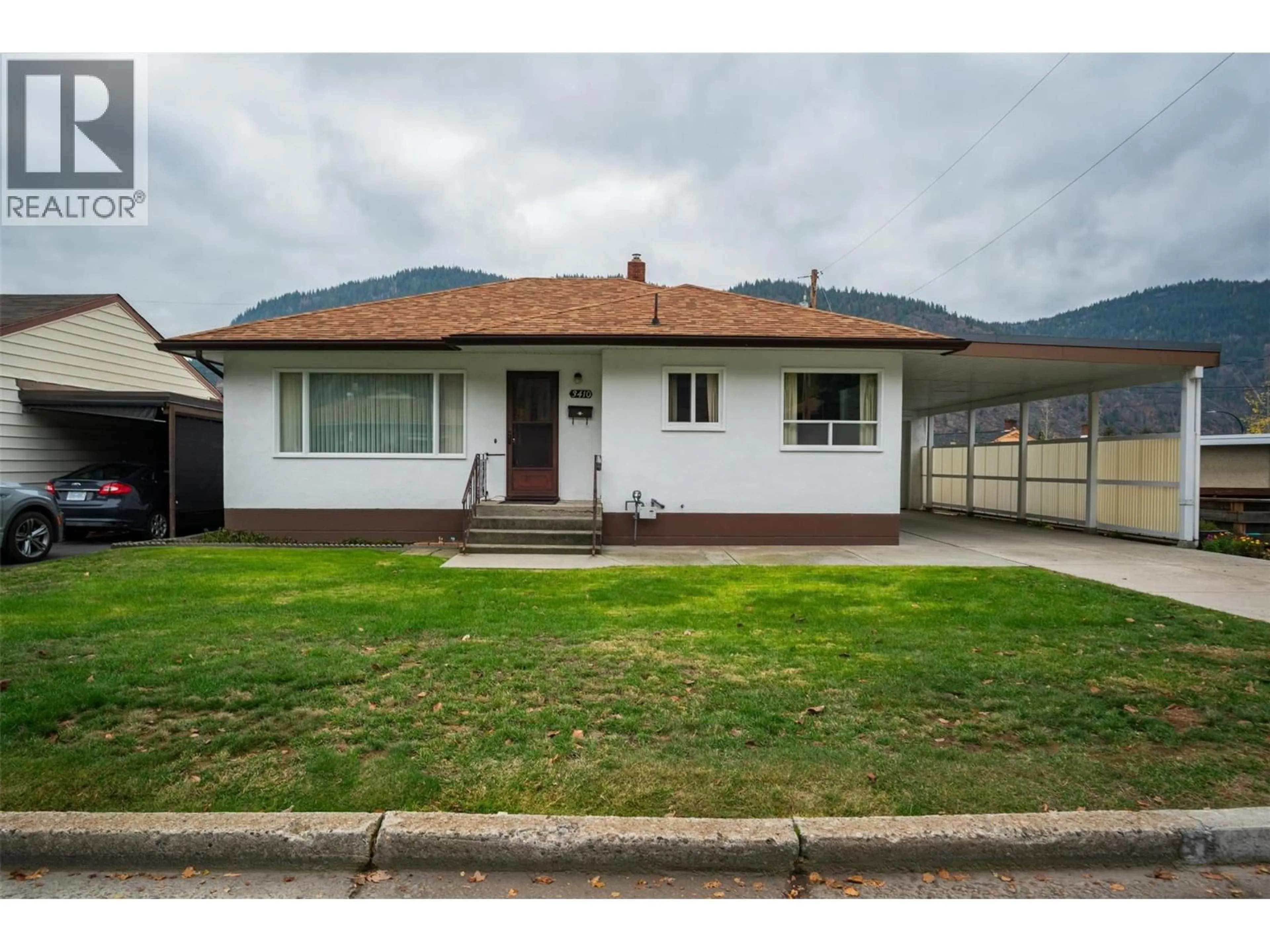 A pic from outside/outdoor area/front of a property/back of a property/a pic from drone, street for 3410 ASTER DRIVE, Trail British Columbia V1R2X3