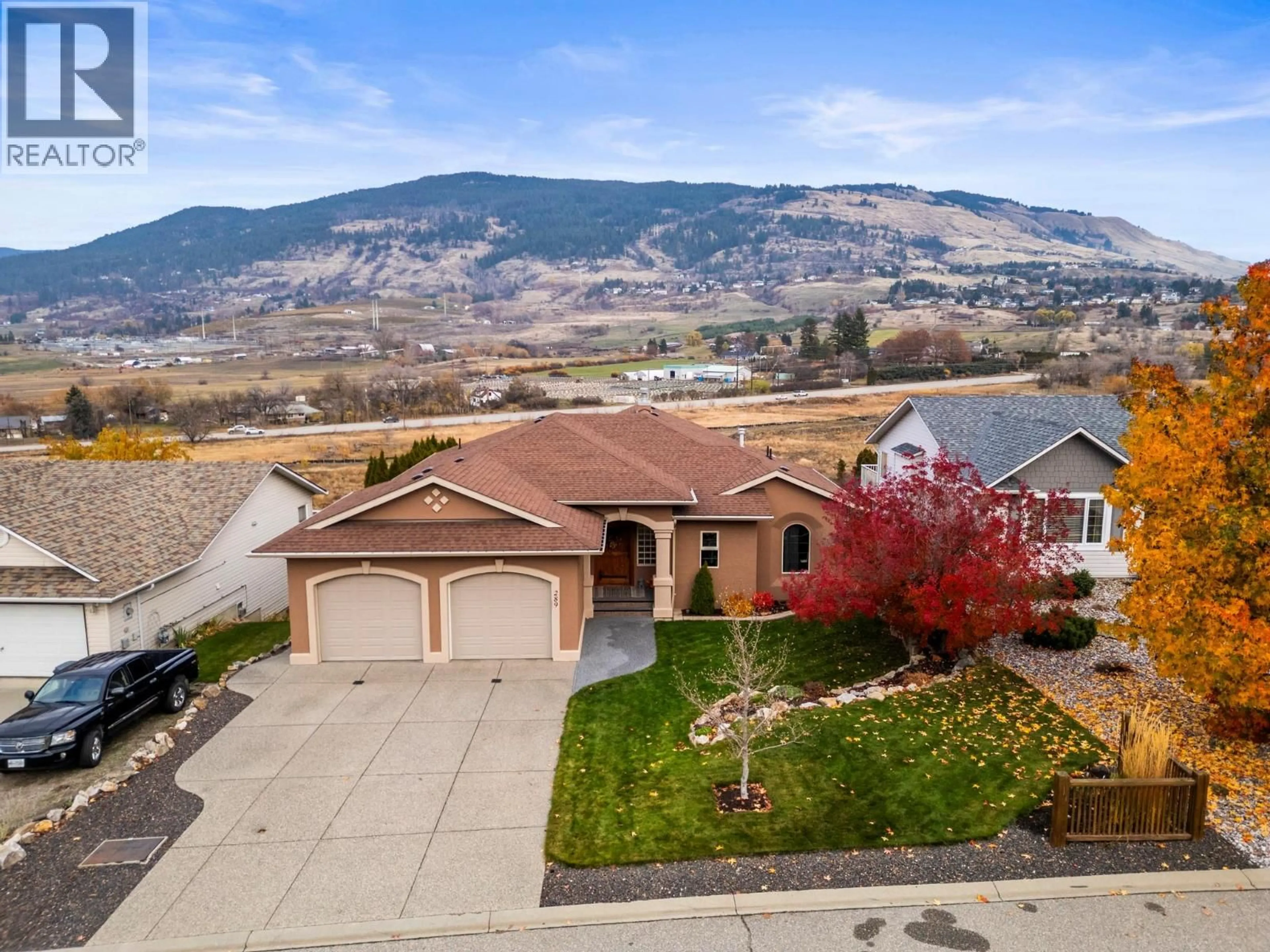 A pic from outside/outdoor area/front of a property/back of a property/a pic from drone, mountain view for 289 INVERNESS DRIVE, Coldstream British Columbia V1B3W1