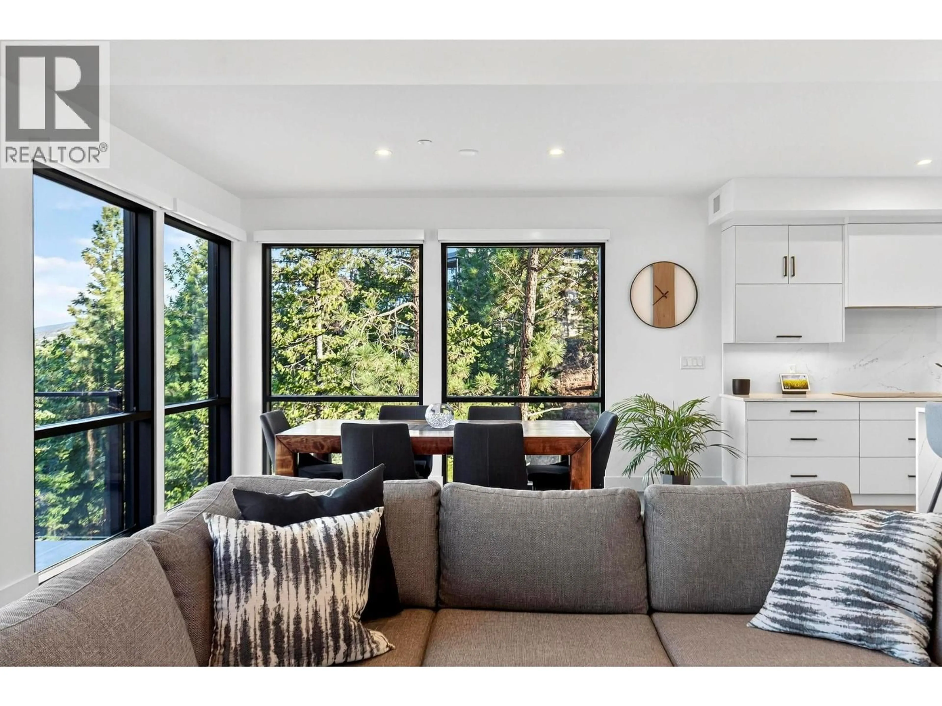 Living room with furniture, wood/laminate floor for 408 - 3434 MCKINLEY BEACH DRIVE, Kelowna British Columbia V1V0H3