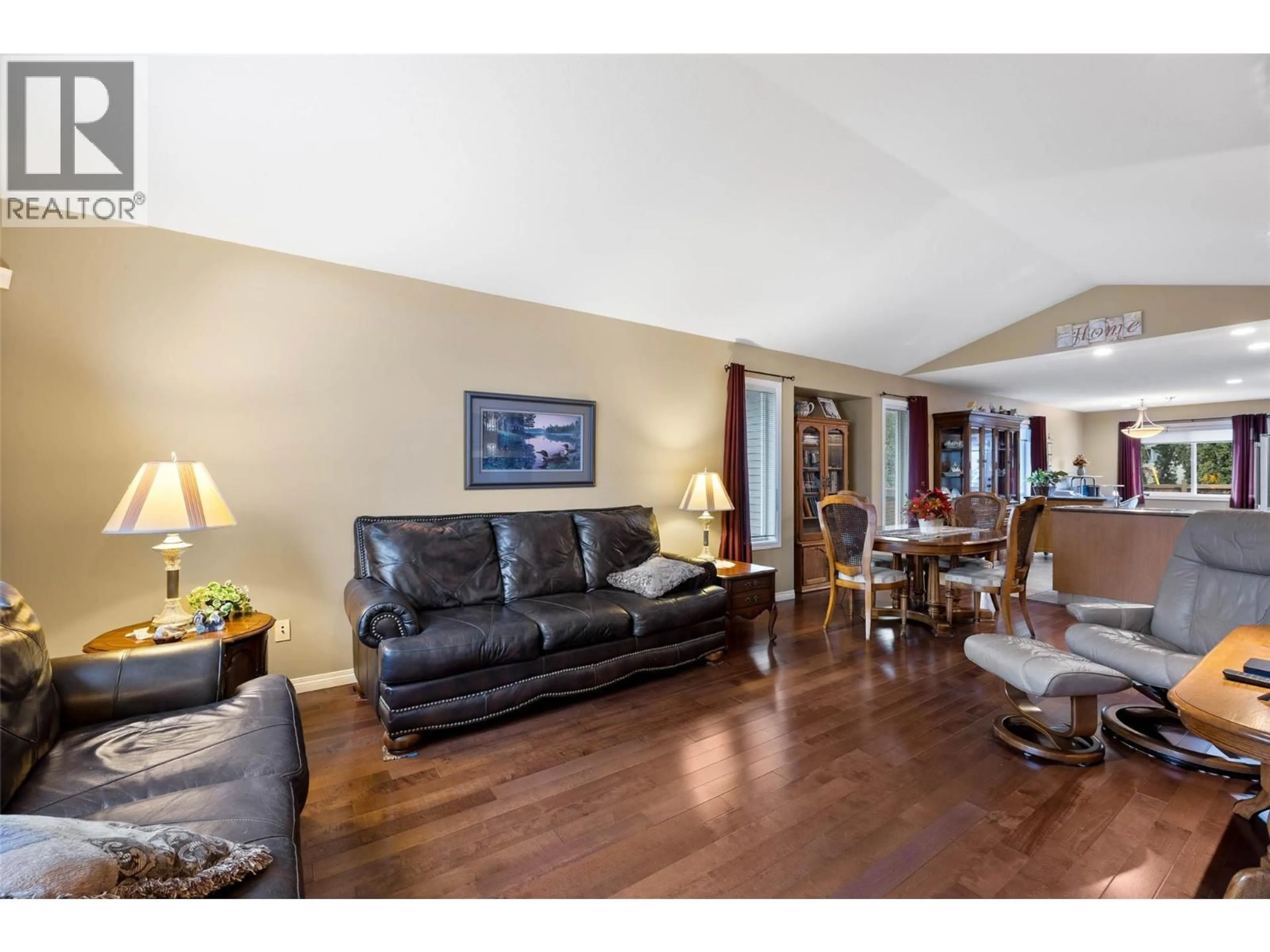 Living room with furniture, wood/laminate floor for 2185 INVERMERE PLACE, Kamloops British Columbia V2B0B2