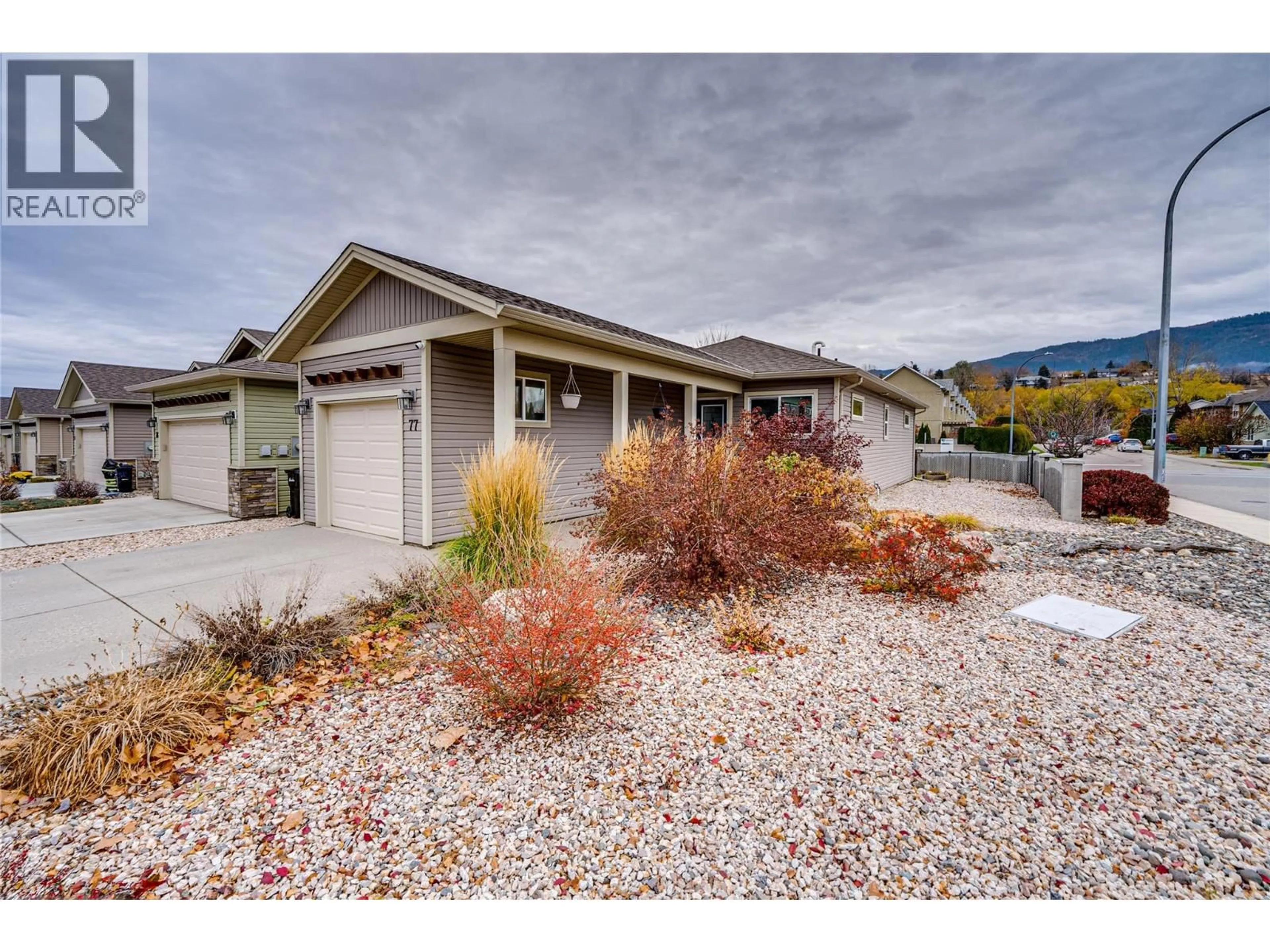 Home with vinyl exterior material, street for 77 - 2100 55 AVENUE, Vernon British Columbia V1T9Y6