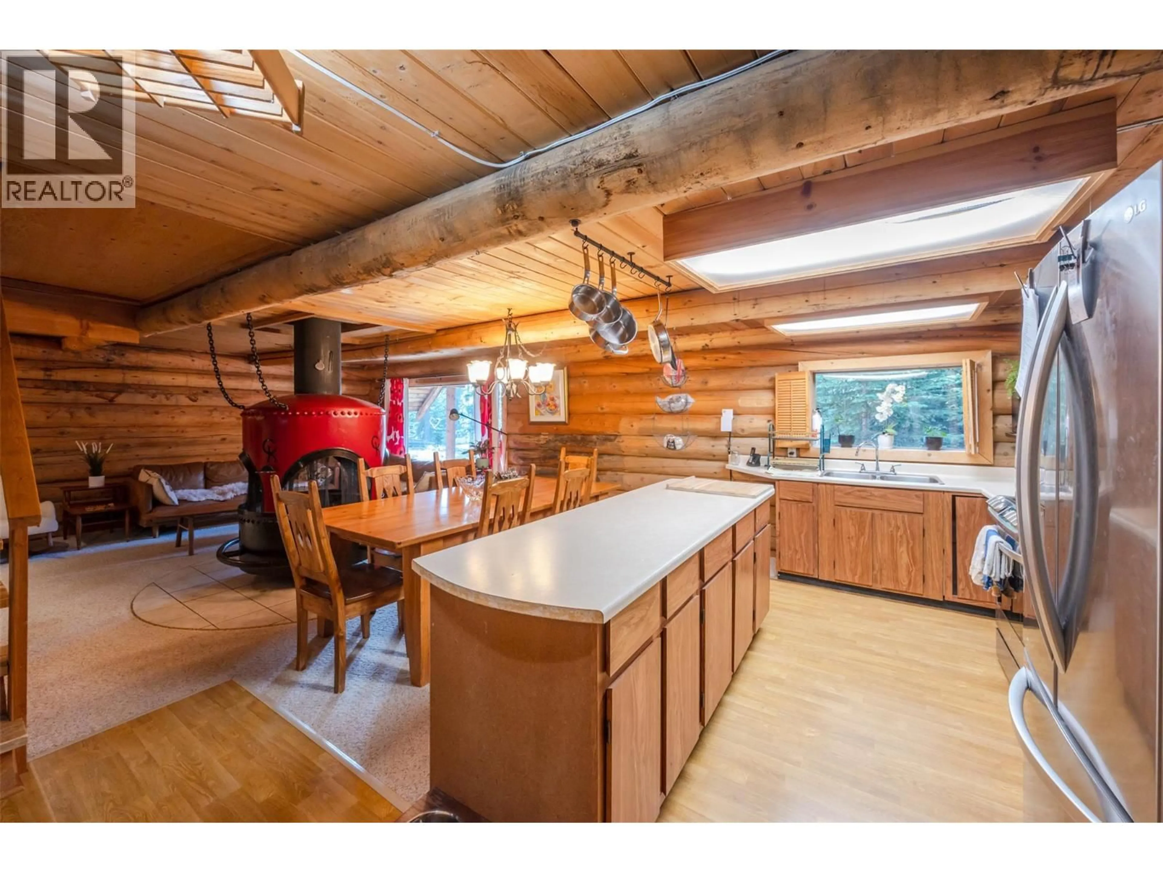 Open concept kitchen, wood/laminate floor for 121 THE CIRCLE, Apex Mountain British Columbia V2A0E2
