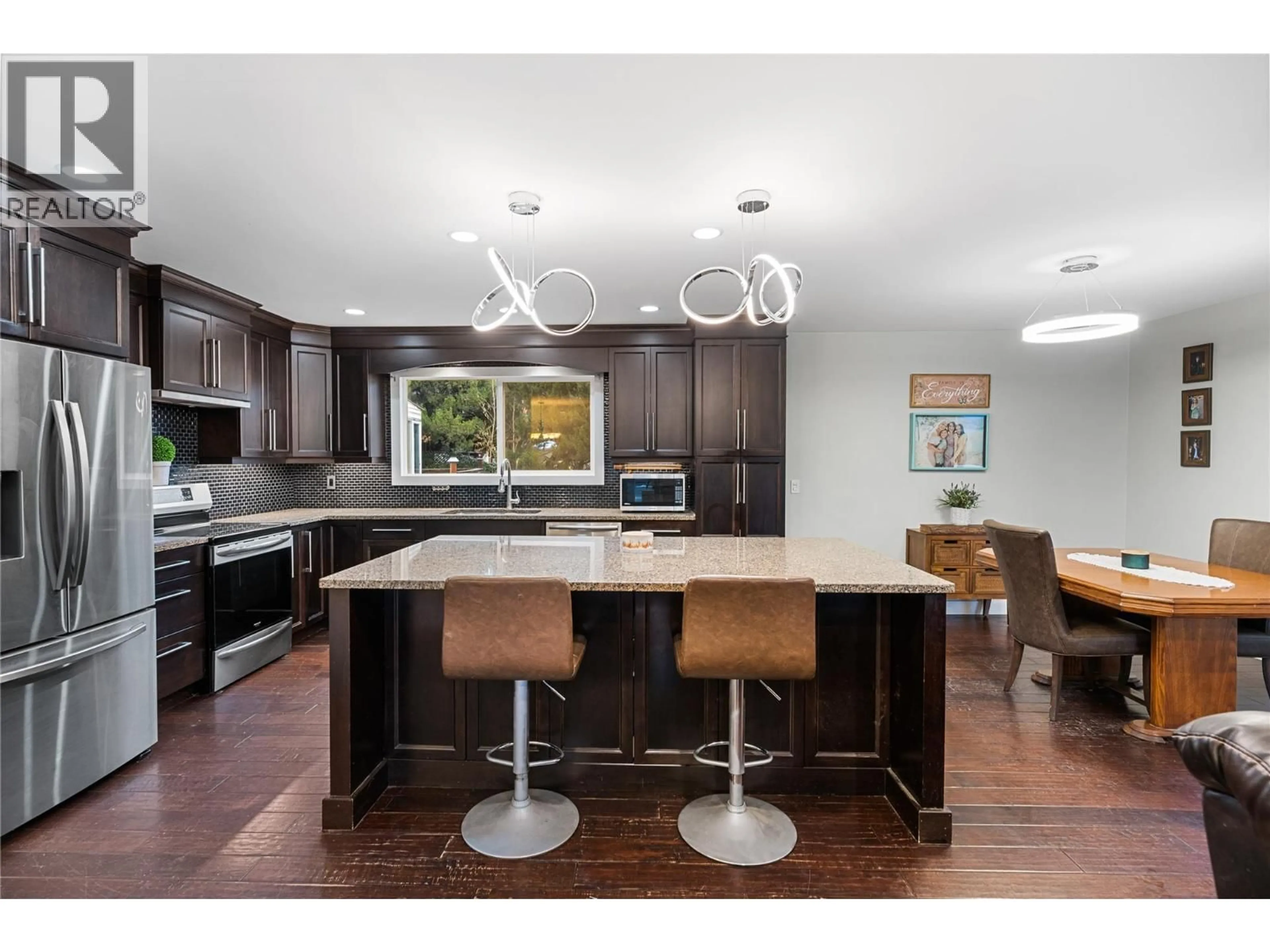 Open concept kitchen, wood/laminate floor for 2555 O'REILLY ROAD, Kelowna British Columbia V1W2V5