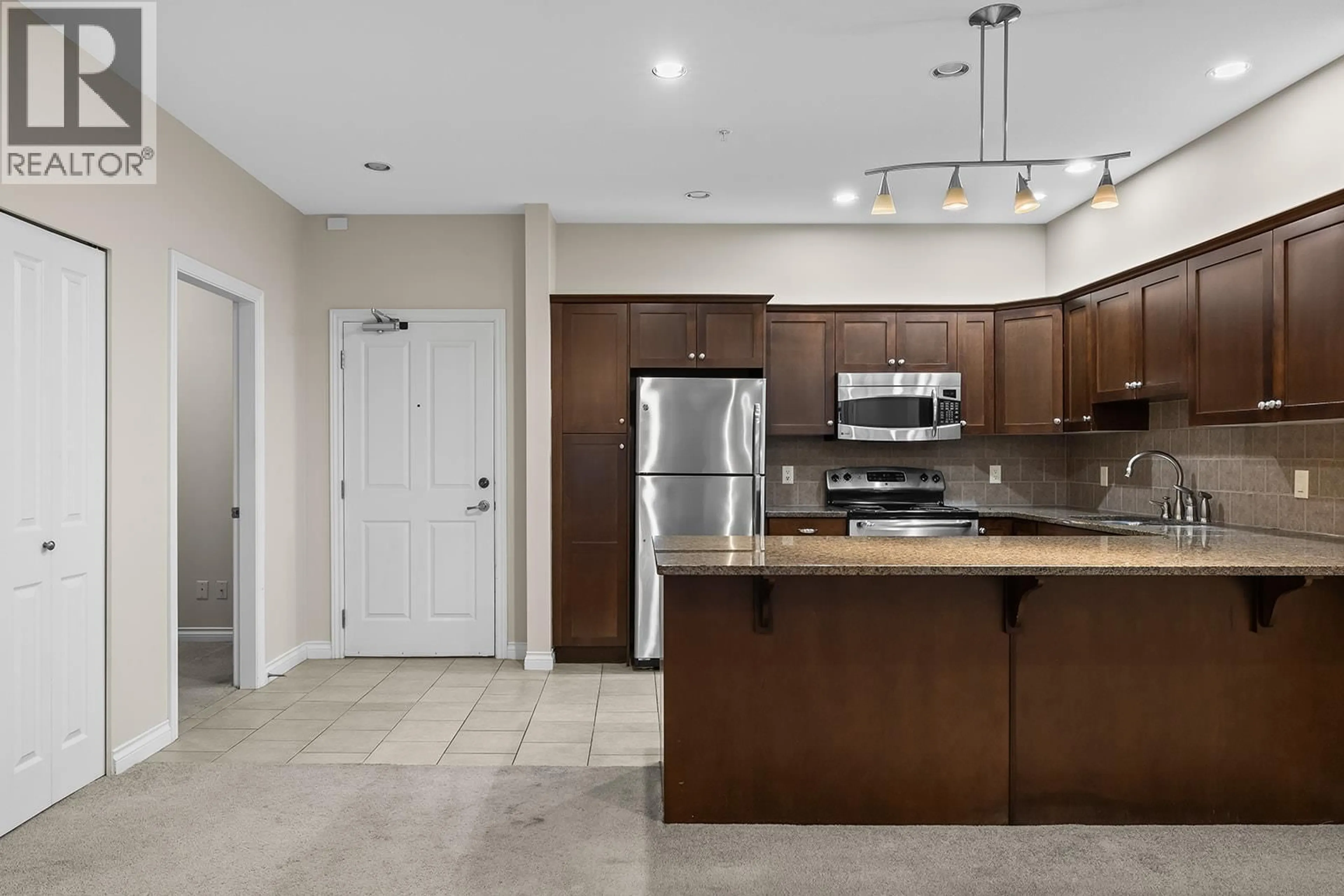 Open concept kitchen, ceramic/tile floor for 2211 - 3843 BROWN ROAD, West Kelowna British Columbia V4Y2J3