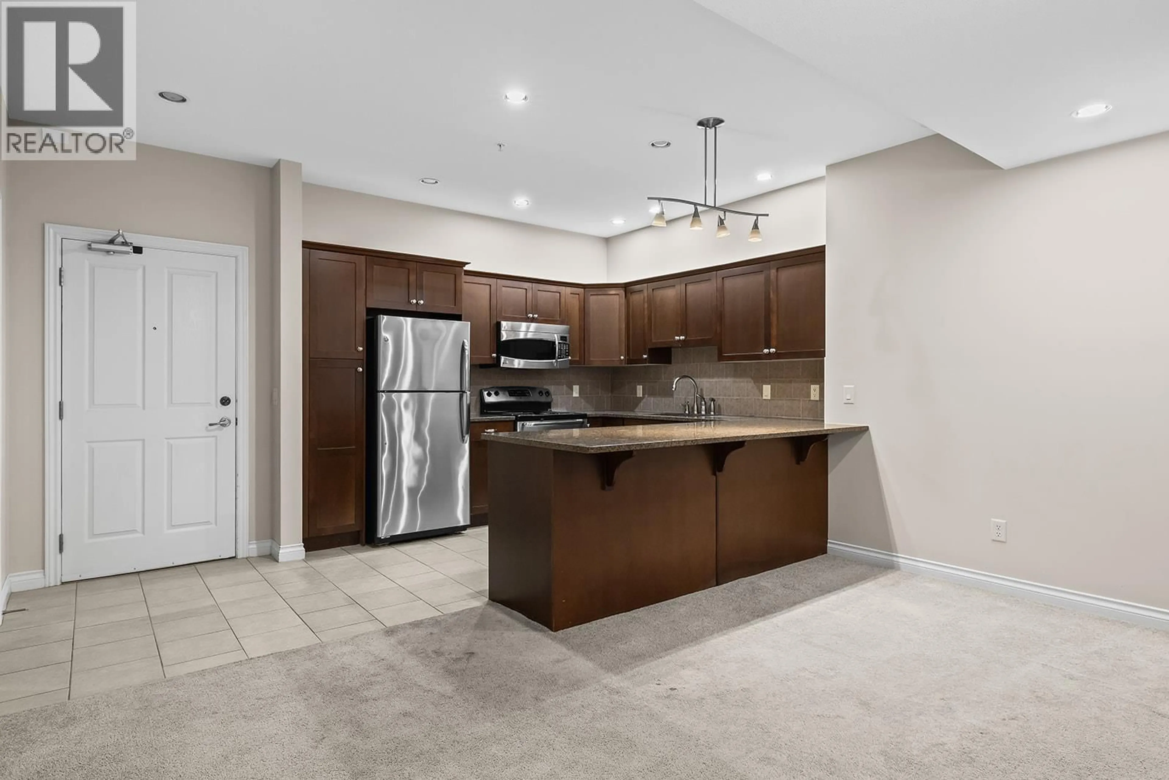 Open concept kitchen, ceramic/tile floor for 2211 - 3843 BROWN ROAD, West Kelowna British Columbia V4Y2J3
