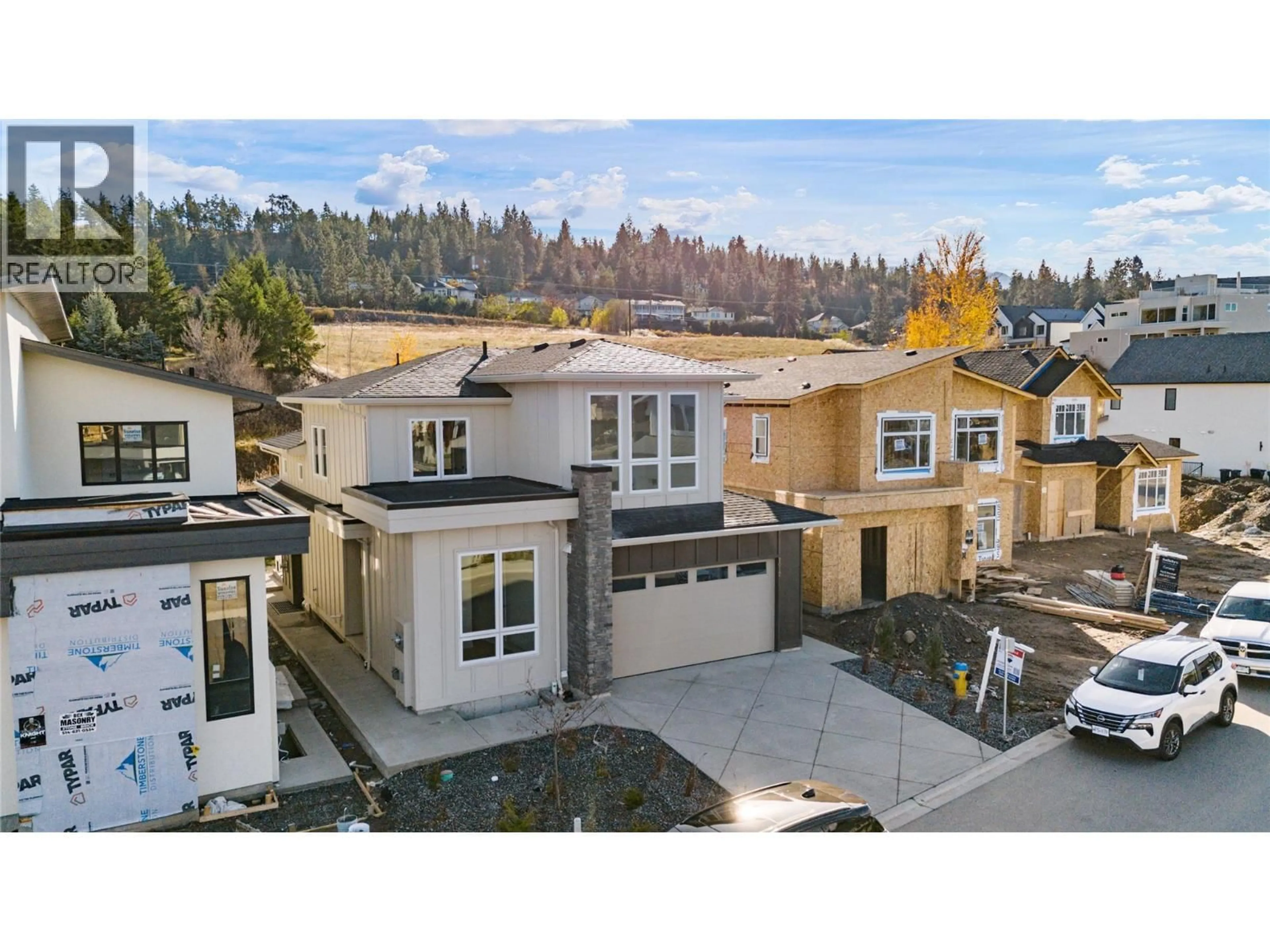 A pic from outside/outdoor area/front of a property/back of a property/a pic from drone, street for 1012 BULL CRESCENT, Kelowna British Columbia V1W0E6