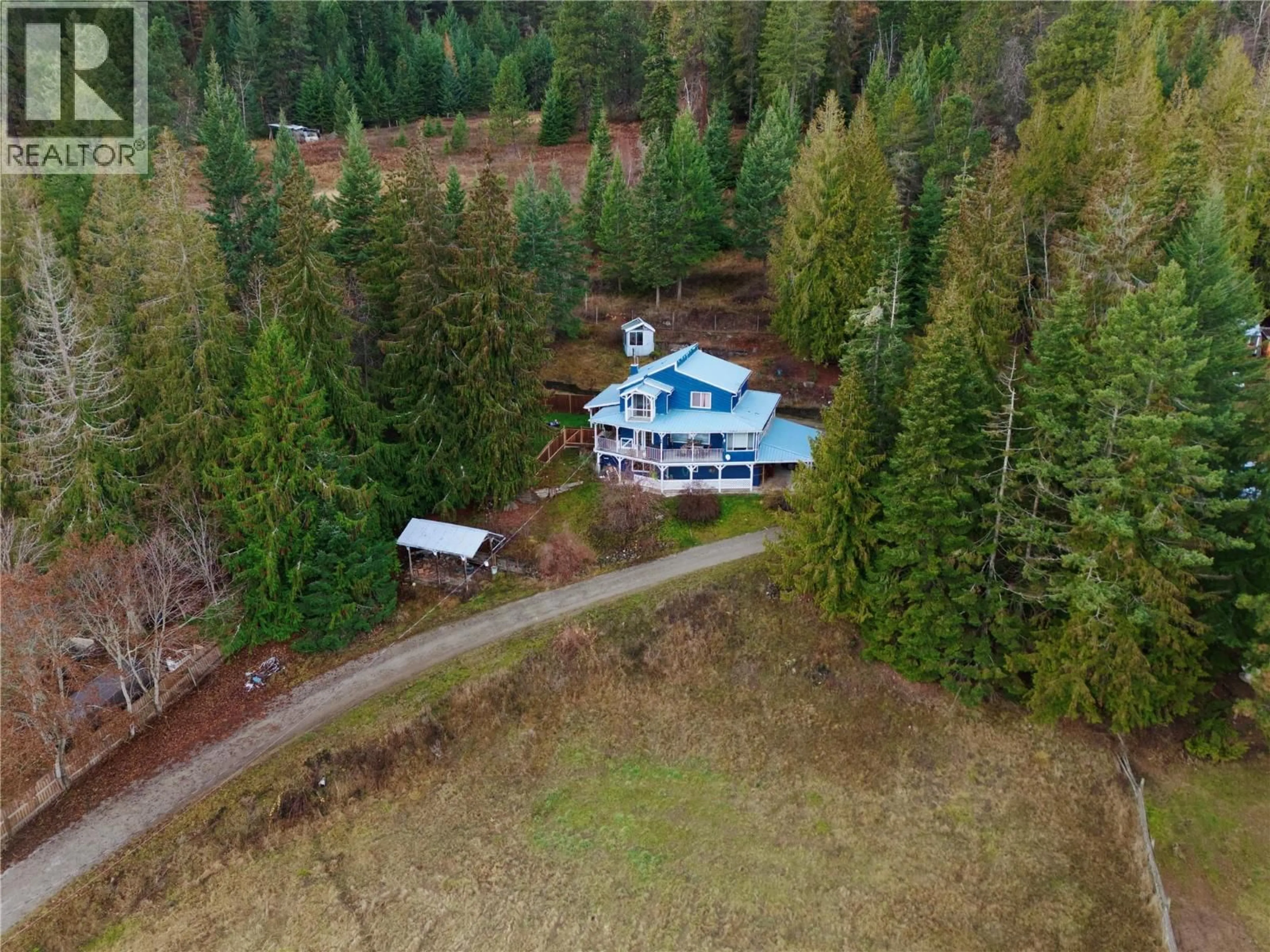 A pic from outside/outdoor area/front of a property/back of a property/a pic from drone, forest/trees view for 1621 EVANS ROAD, Creston British Columbia V0B1G7