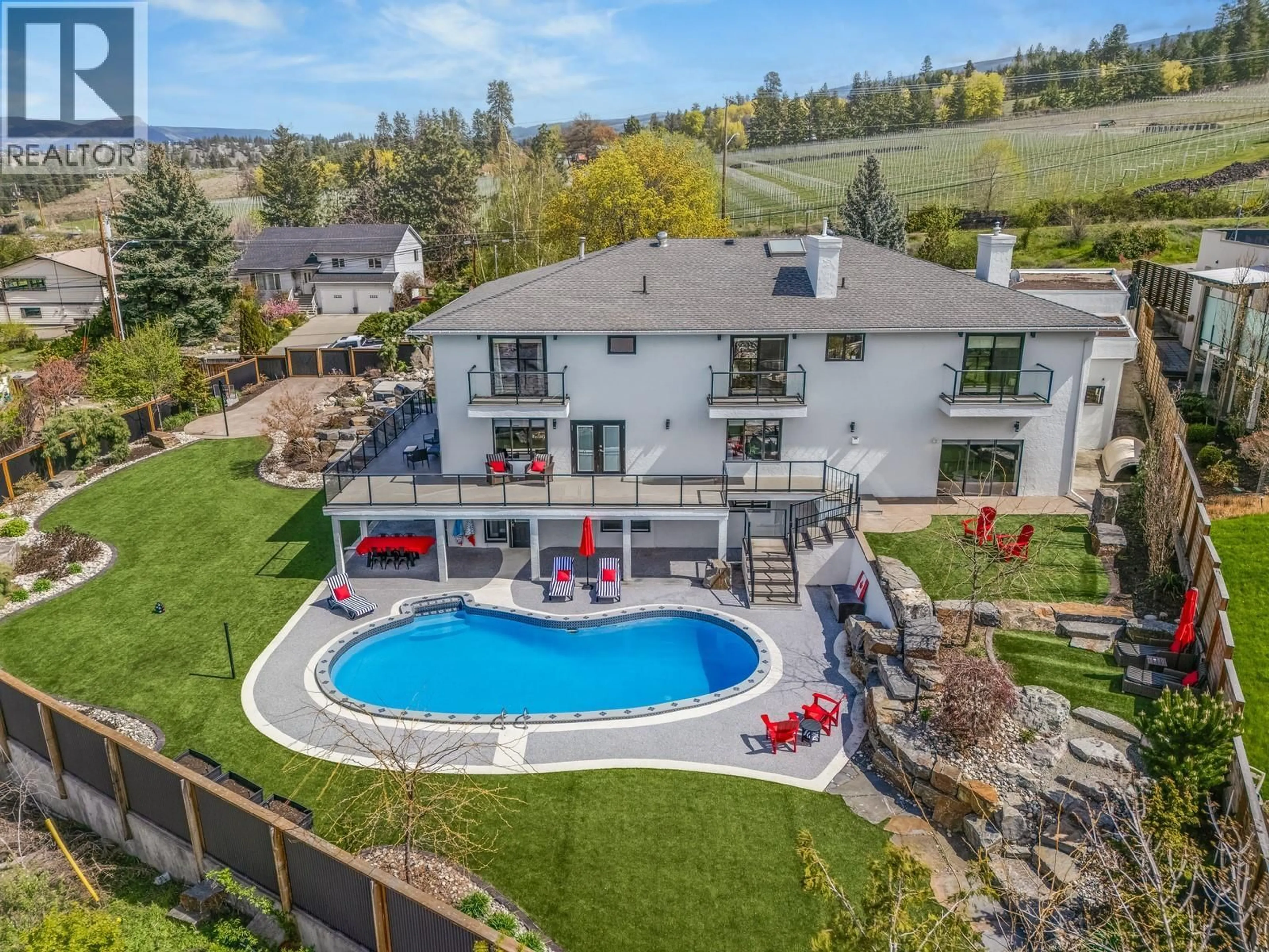 A pic from outside/outdoor area/front of a property/back of a property/a pic from drone, water/lake/river/ocean view for 4812 LAKESHORE PLACE, Kelowna British Columbia V1W4H6
