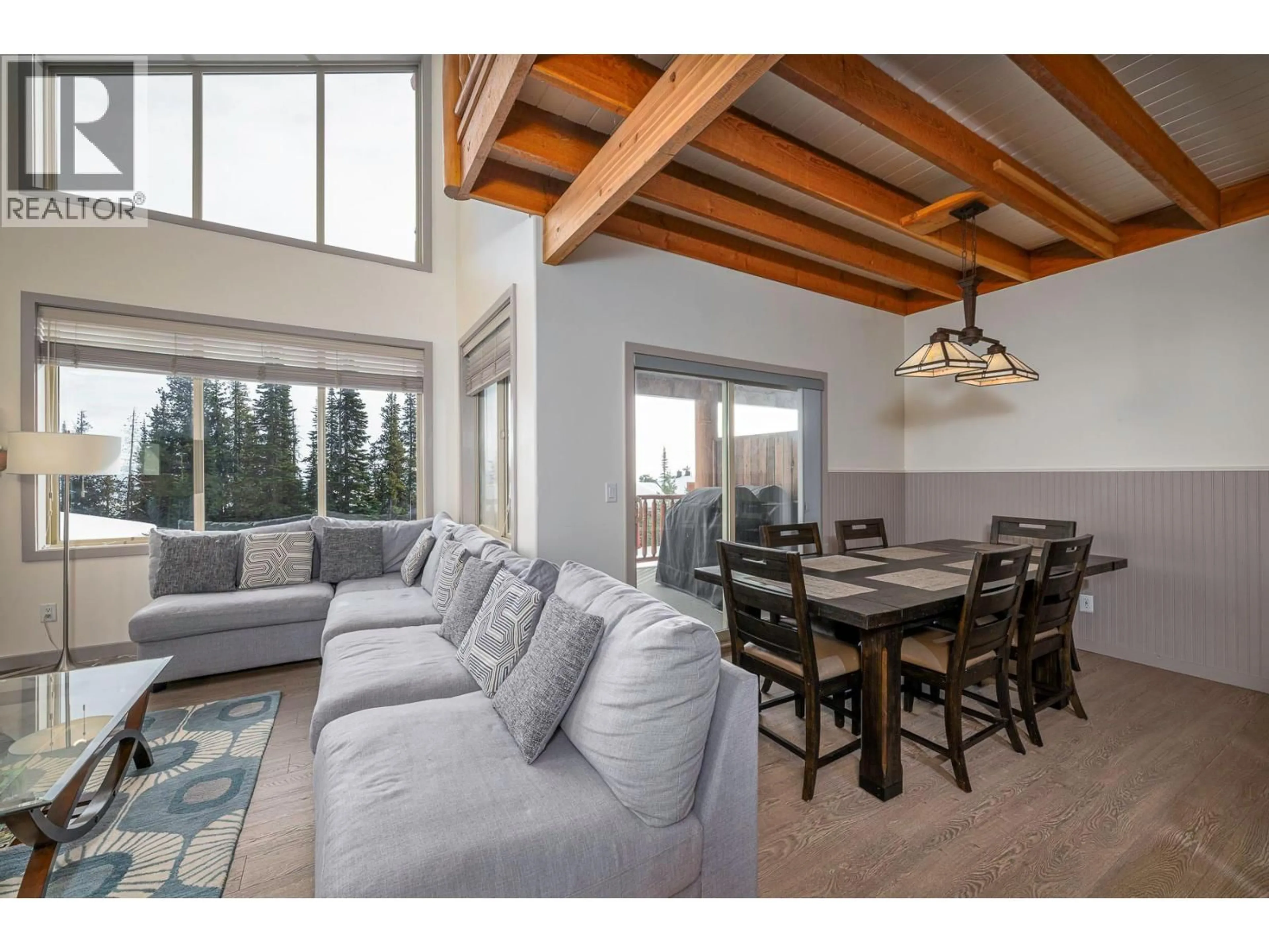 Living room with furniture, wood/laminate floor for 2 - 5940 SNOWPINES WAY, Big White British Columbia V1P1T4
