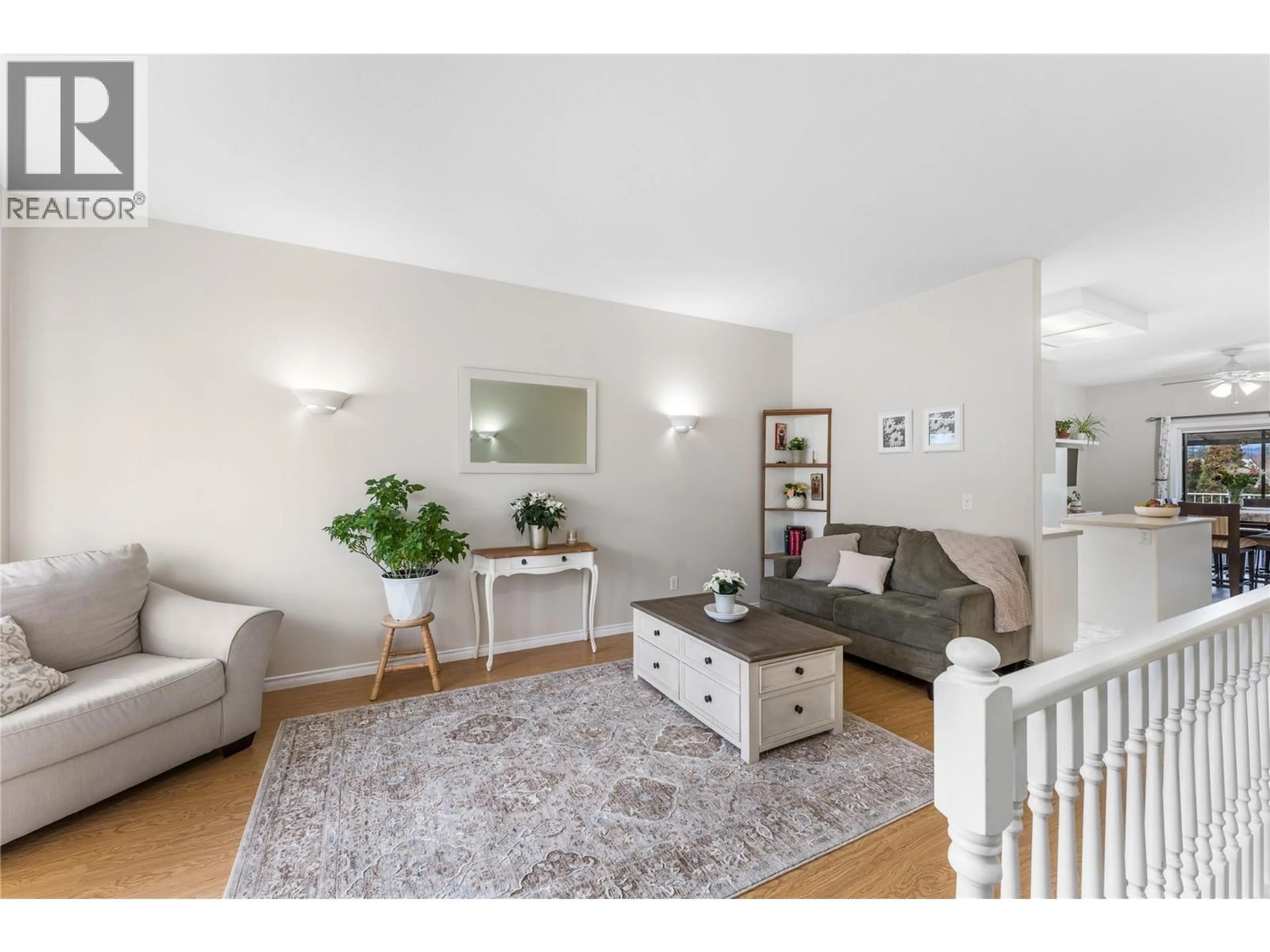 Living room with furniture, wood/laminate floor for 45 - 6100 OLD VERNON ROAD, Kelowna British Columbia V1X7T8