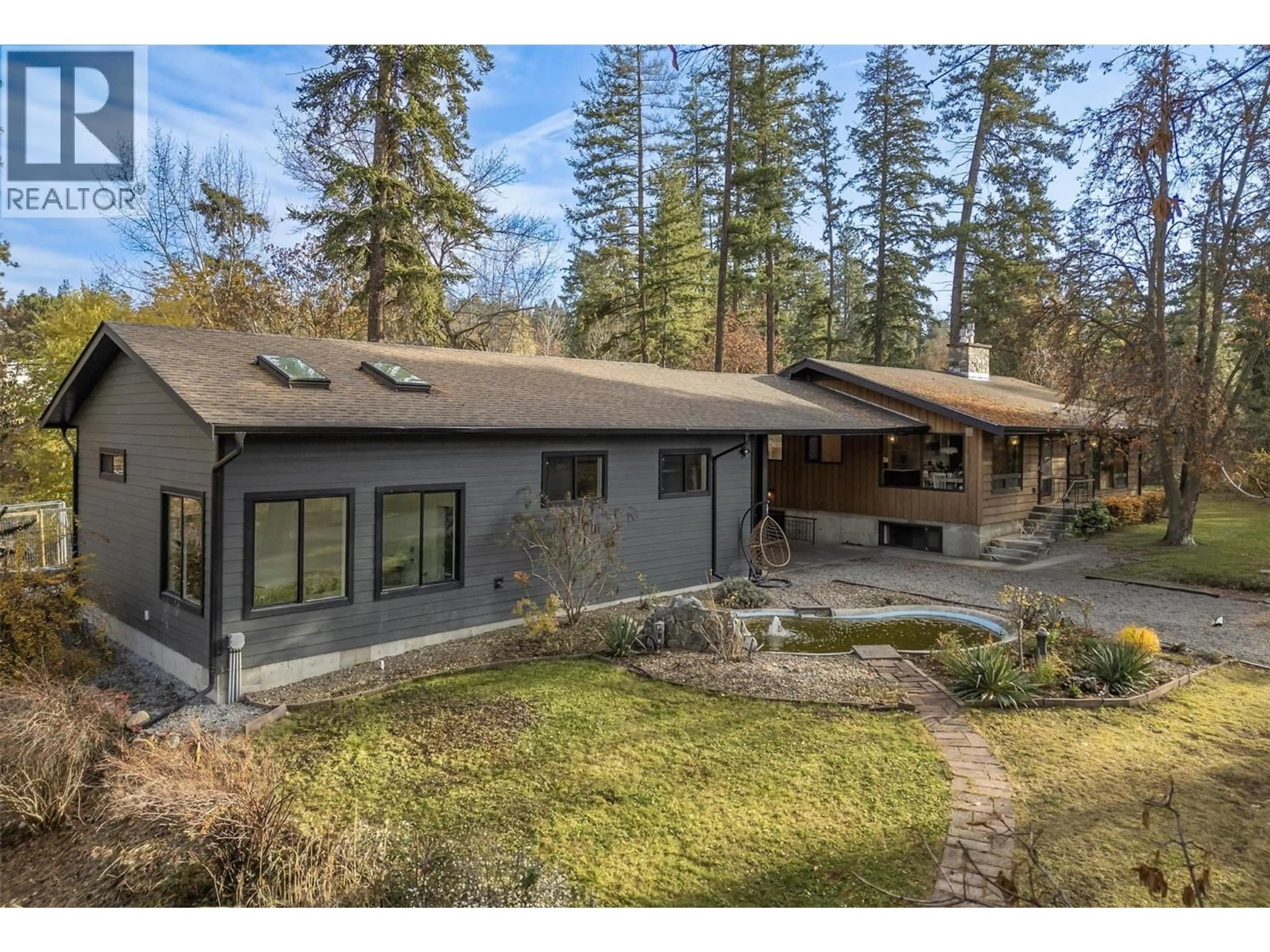 A pic from outside/outdoor area/front of a property/back of a property/a pic from drone, forest/trees view for 3153 HALL ROAD, Kelowna British Columbia V1W2R8