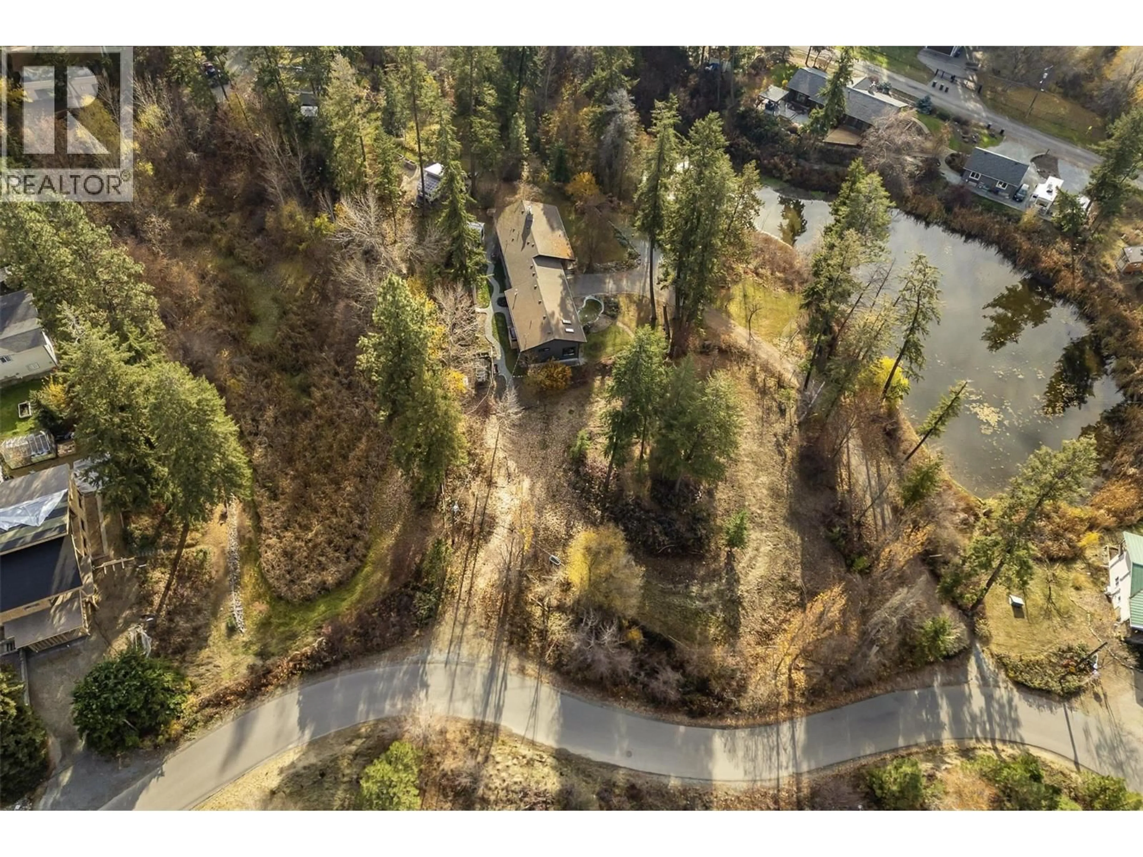 A pic from outside/outdoor area/front of a property/back of a property/a pic from drone, forest/trees view for 3153 HALL ROAD, Kelowna British Columbia V1W2R8