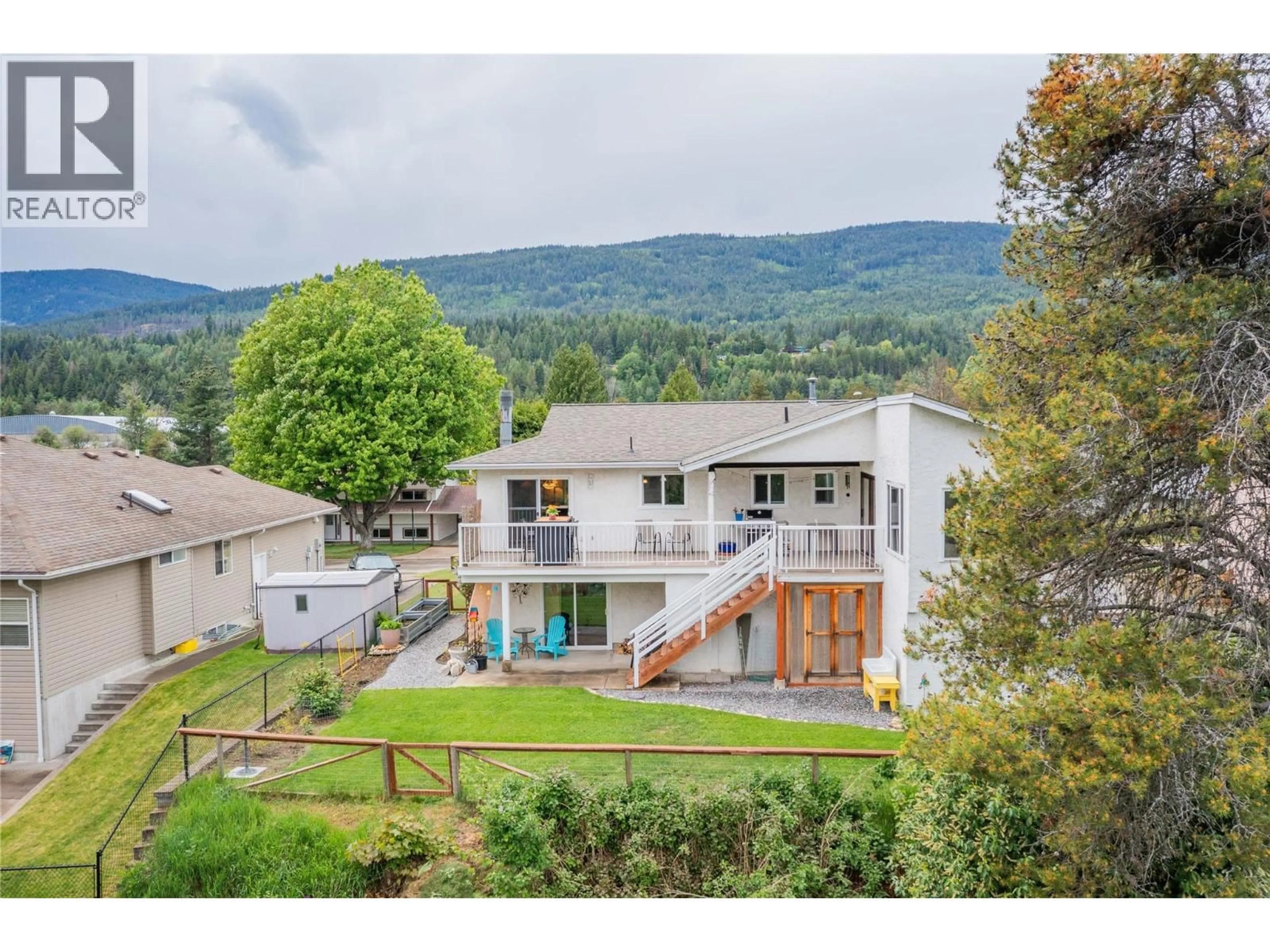 A pic from outside/outdoor area/front of a property/back of a property/a pic from drone, mountain view for 1923 RIVERSIDE CRESCENT, Castlegar British Columbia V1N3W5