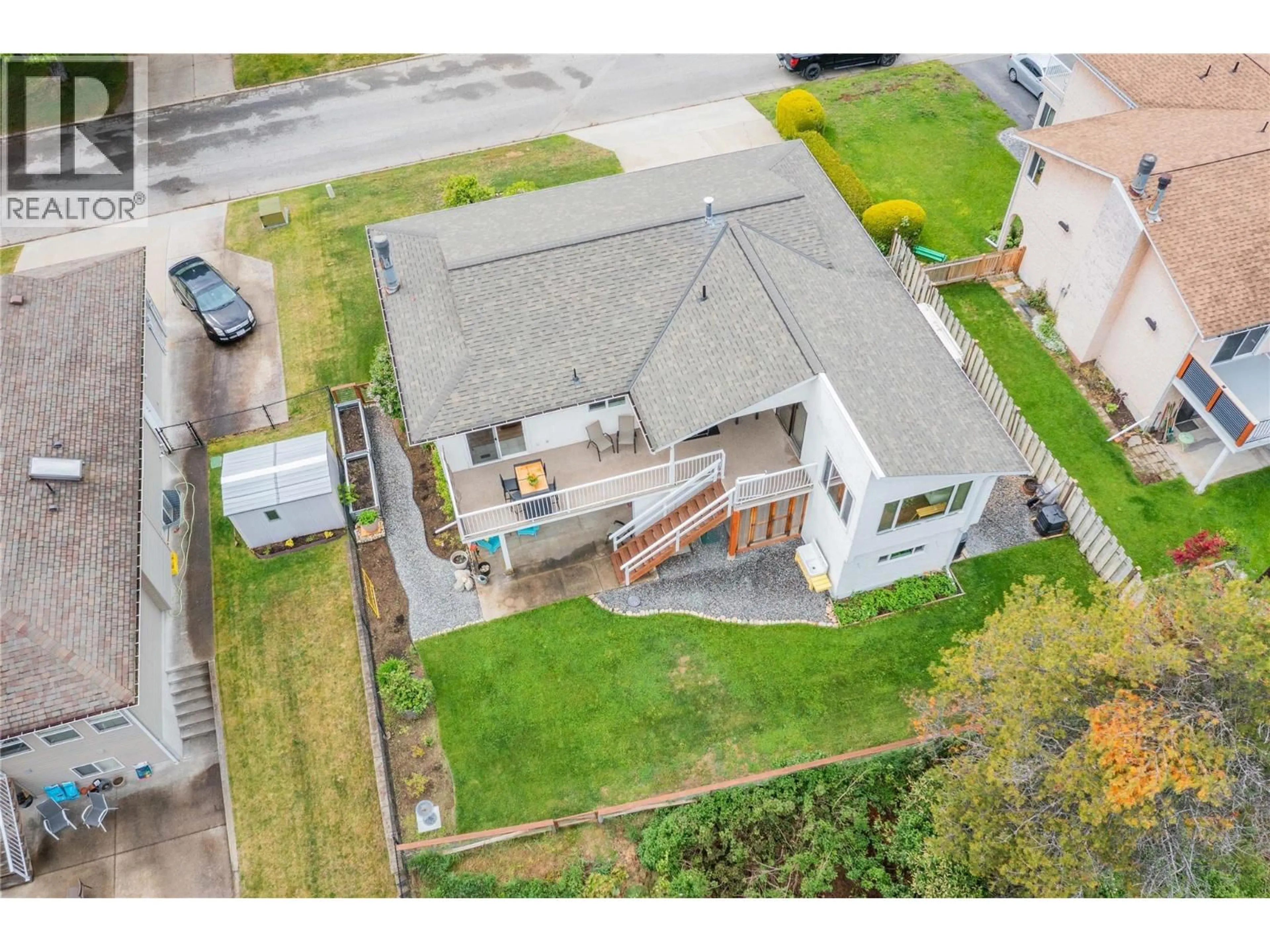 A pic from outside/outdoor area/front of a property/back of a property/a pic from drone, street for 1923 RIVERSIDE CRESCENT, Castlegar British Columbia V1N3W5