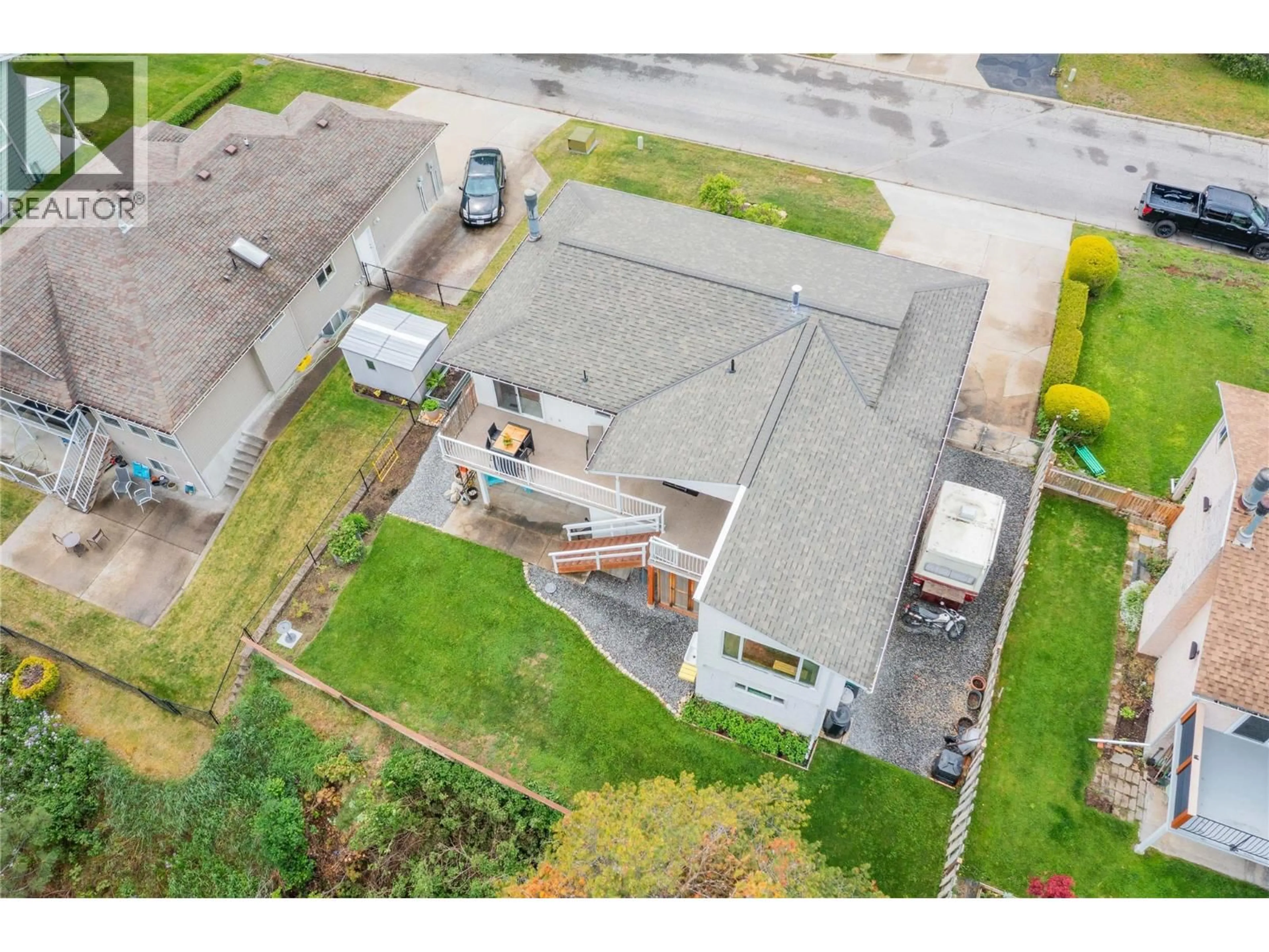 A pic from outside/outdoor area/front of a property/back of a property/a pic from drone, street for 1923 RIVERSIDE CRESCENT, Castlegar British Columbia V1N3W5