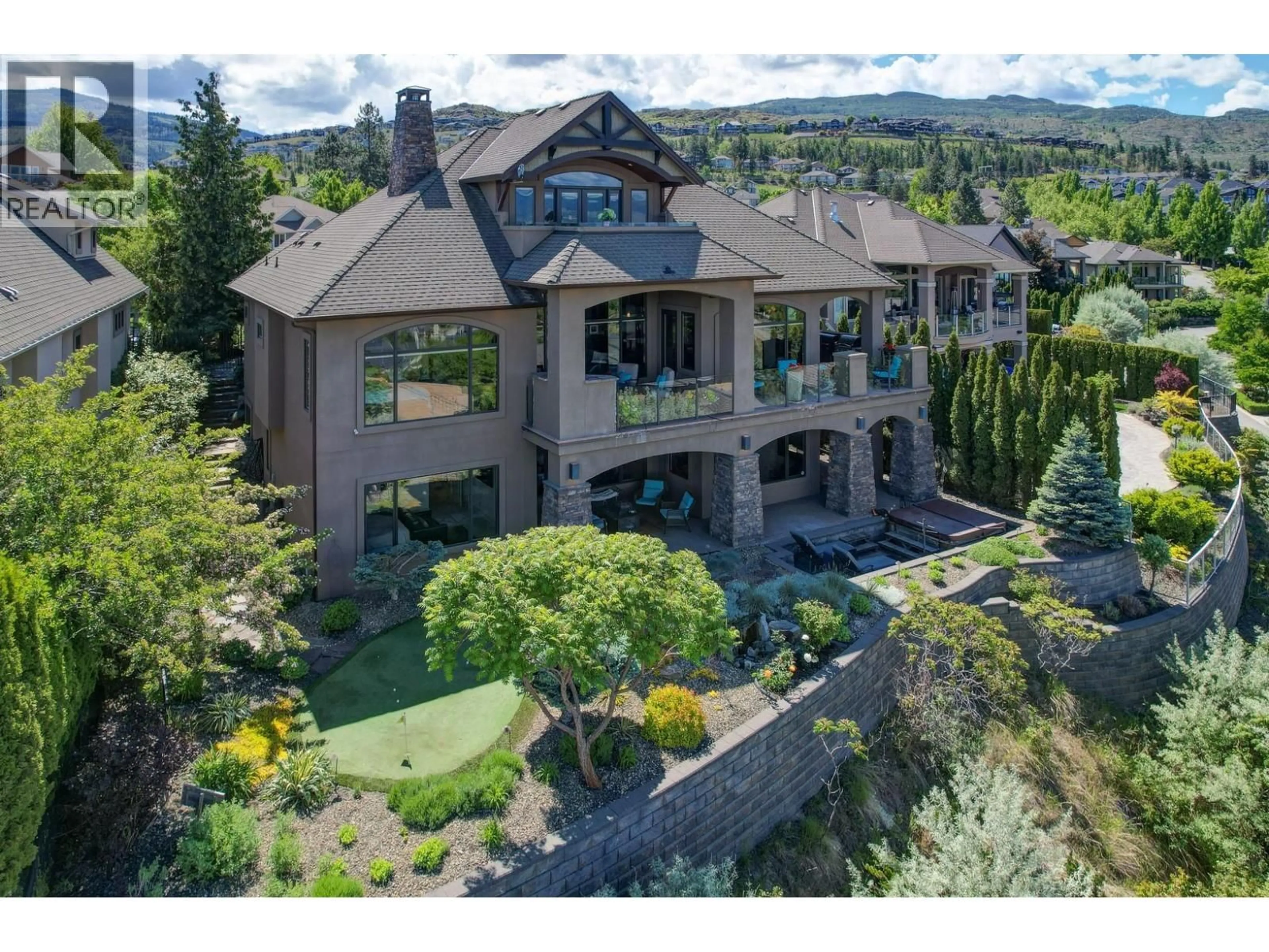 A pic from outside/outdoor area/front of a property/back of a property/a pic from drone, mountain view for 734 MARIN CRESCENT, Kelowna British Columbia V1W5C8