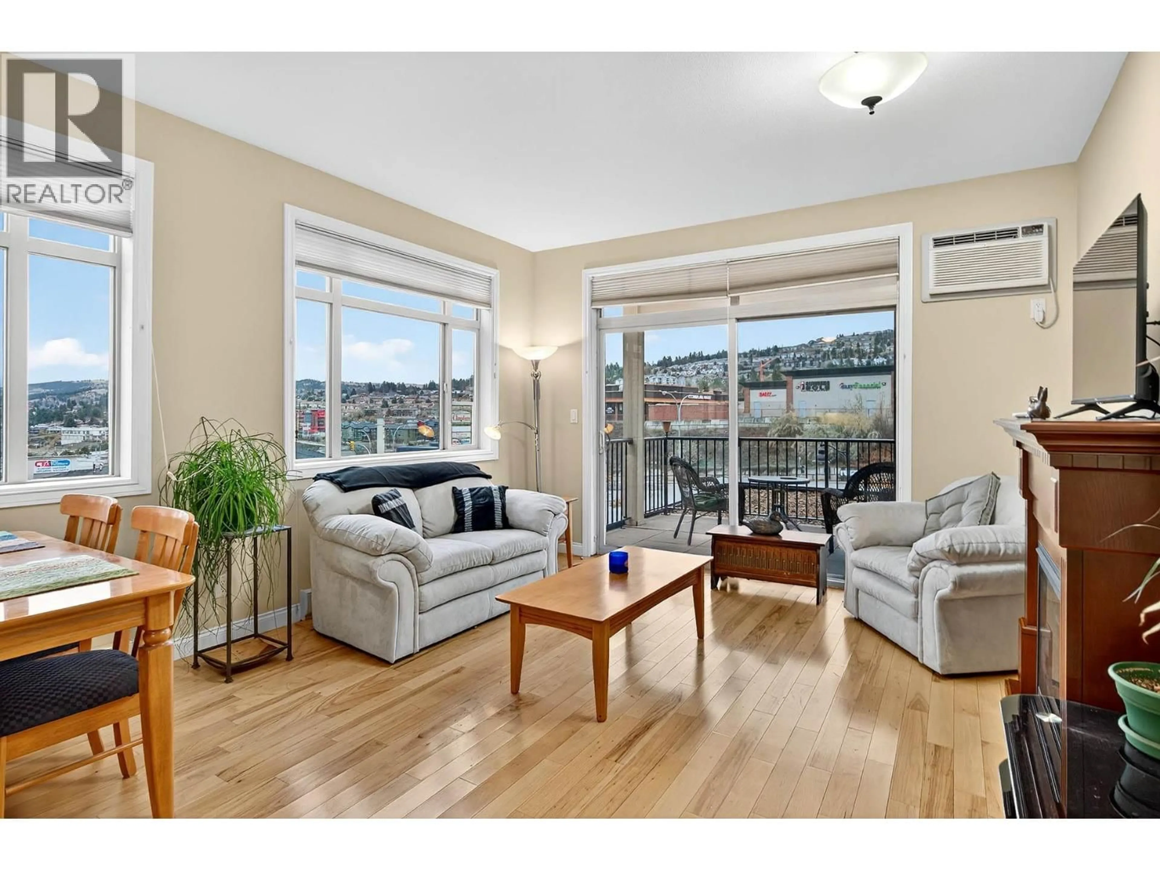 Living room with furniture, wood/laminate floor for 101 - 1390 HILLSIDE DRIVE, Kamloops British Columbia V2E0A6