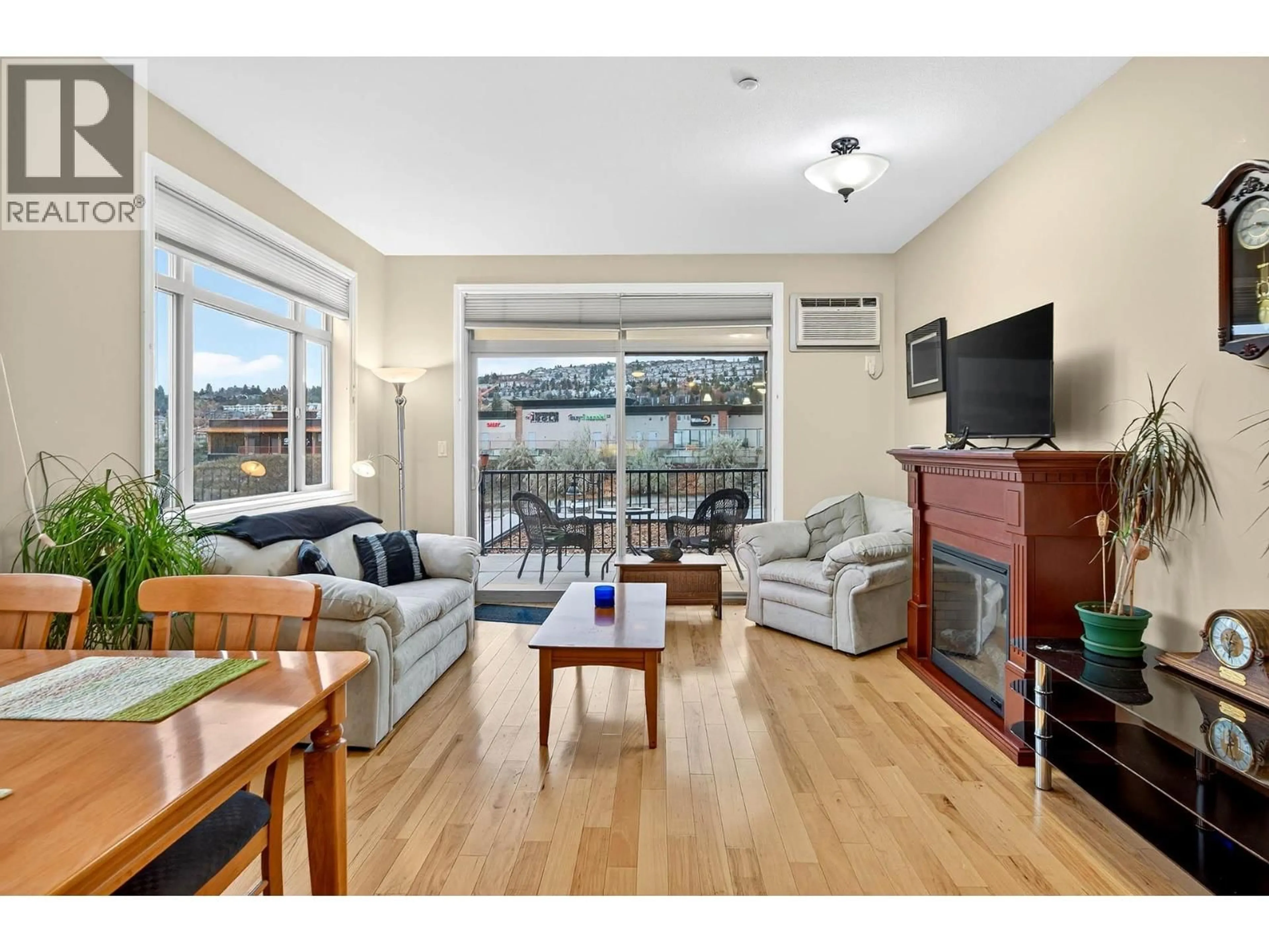 Living room with furniture, wood/laminate floor for 101 - 1390 HILLSIDE DRIVE, Kamloops British Columbia V2E0A6