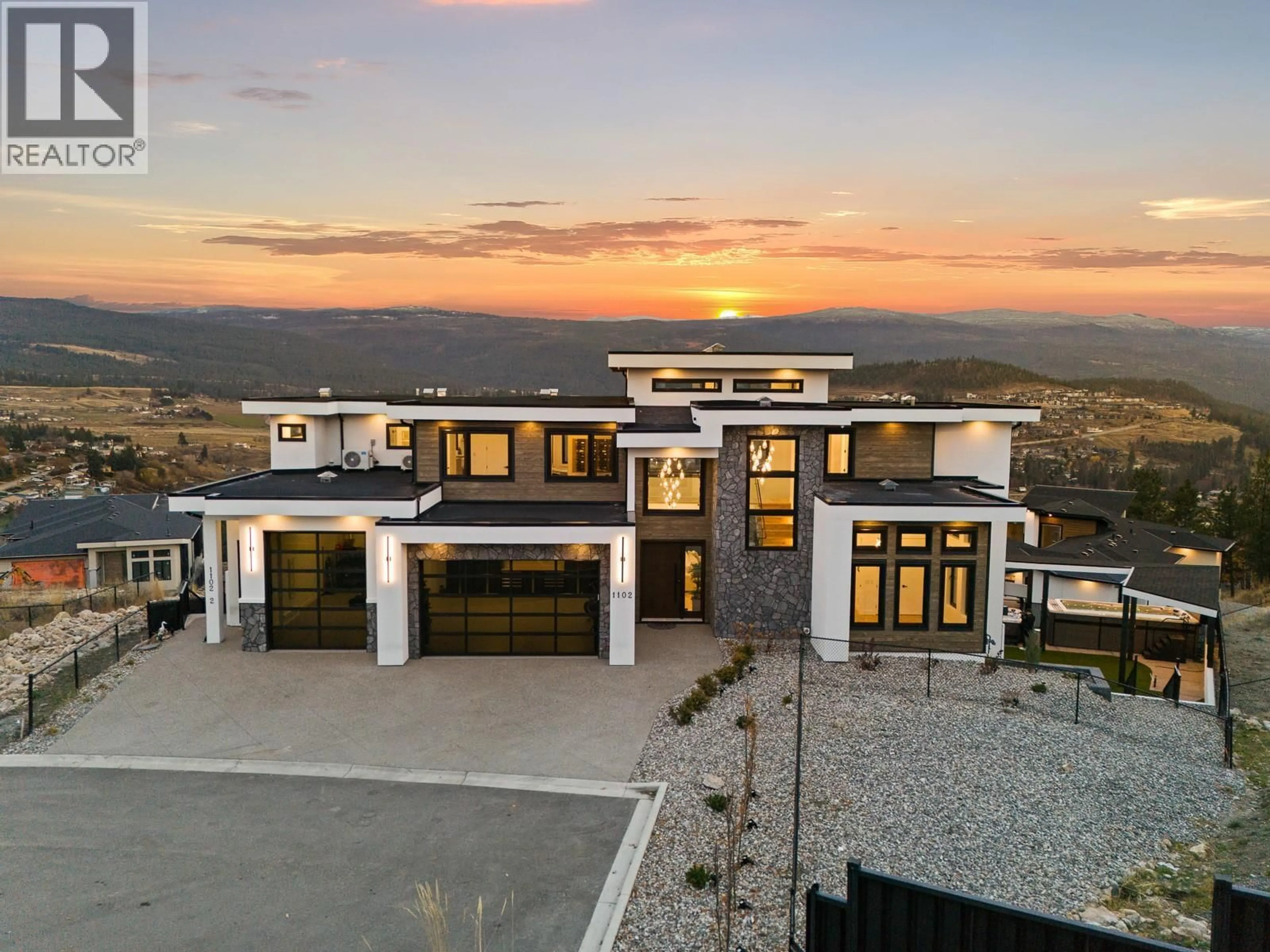 A pic from outside/outdoor area/front of a property/back of a property/a pic from drone, mountain view for 1102 CARNOUSTIE DRIVE, Kelowna British Columbia V1P0A3