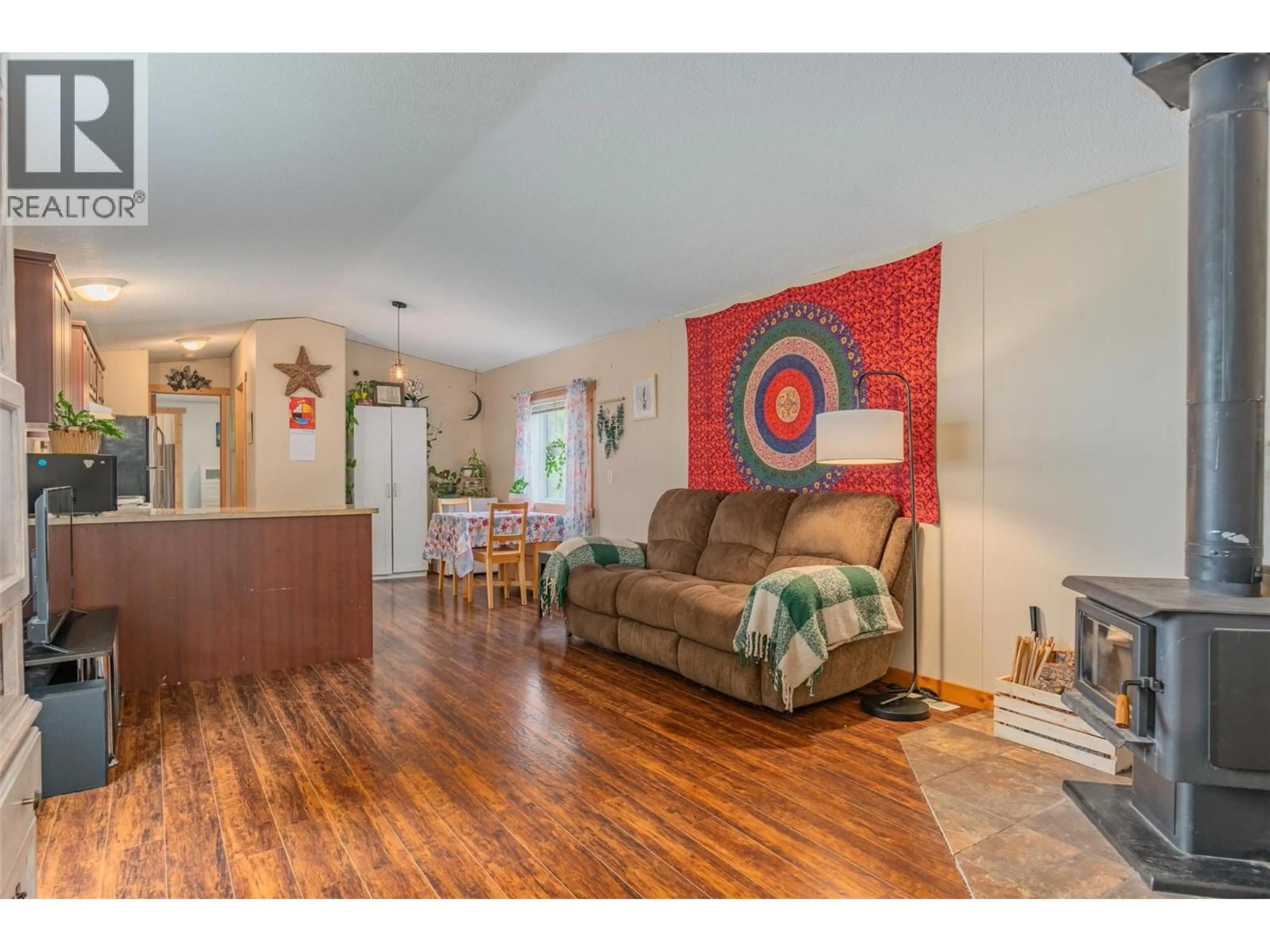 Living room with furniture, wood/laminate floor for 41 - 891 MONTE VISTA DRIVE, Rossland British Columbia V0G1Y0