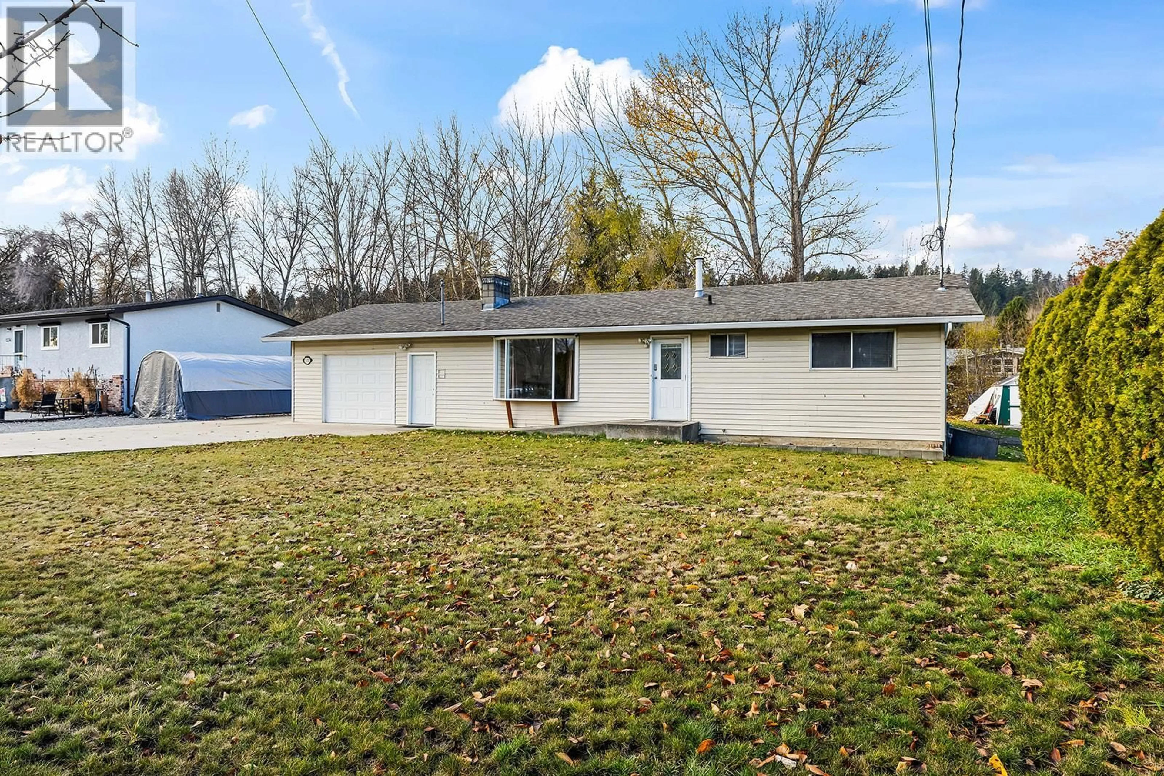 Home with vinyl exterior material, street for 11152 BOTTOM WOOD LAKE ROAD, Lake Country British Columbia V4V1V9