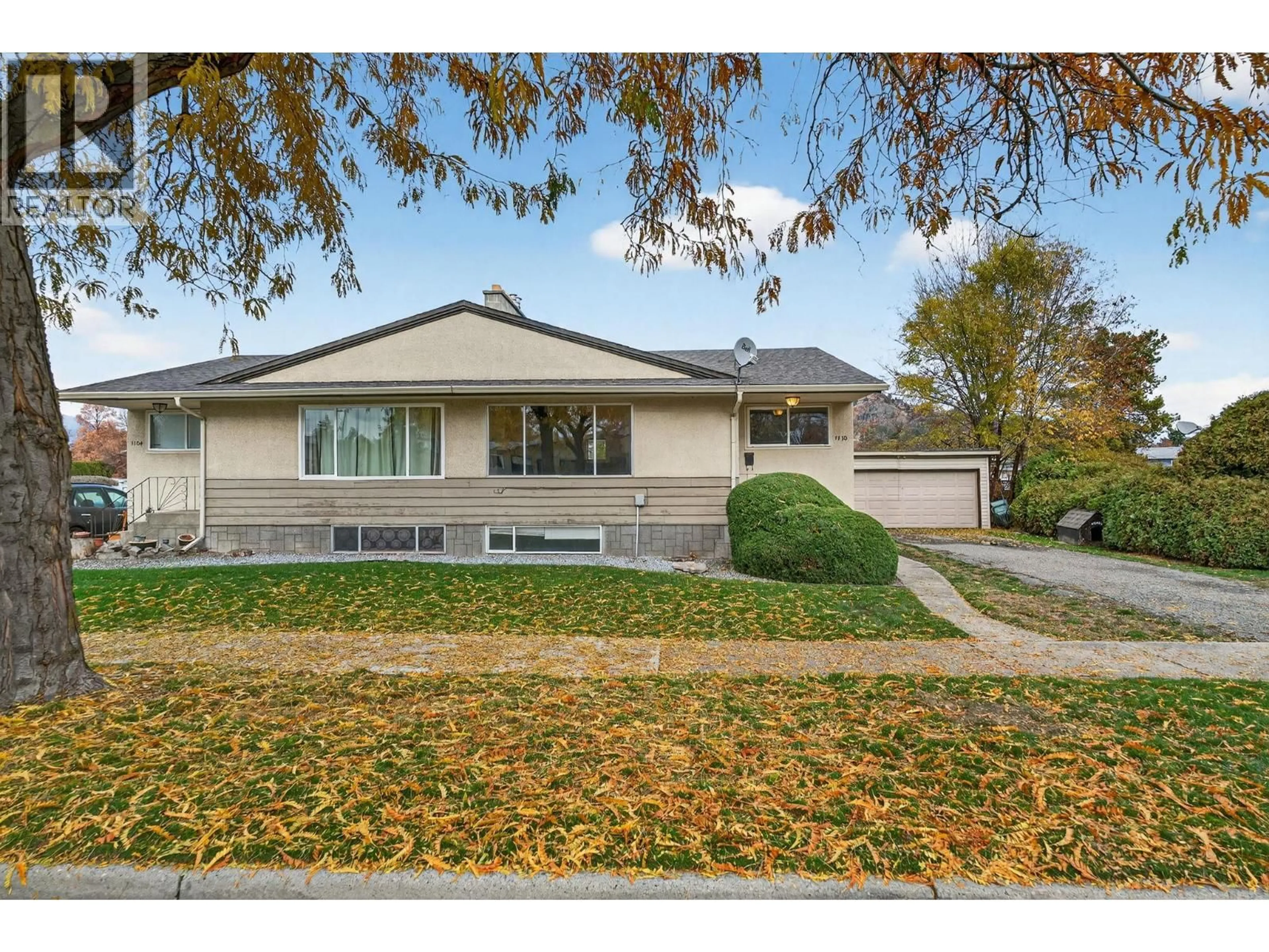 Home with vinyl exterior material, street for 1110 STOCKWELL AVENUE, Kelowna British Columbia V1Y6W6