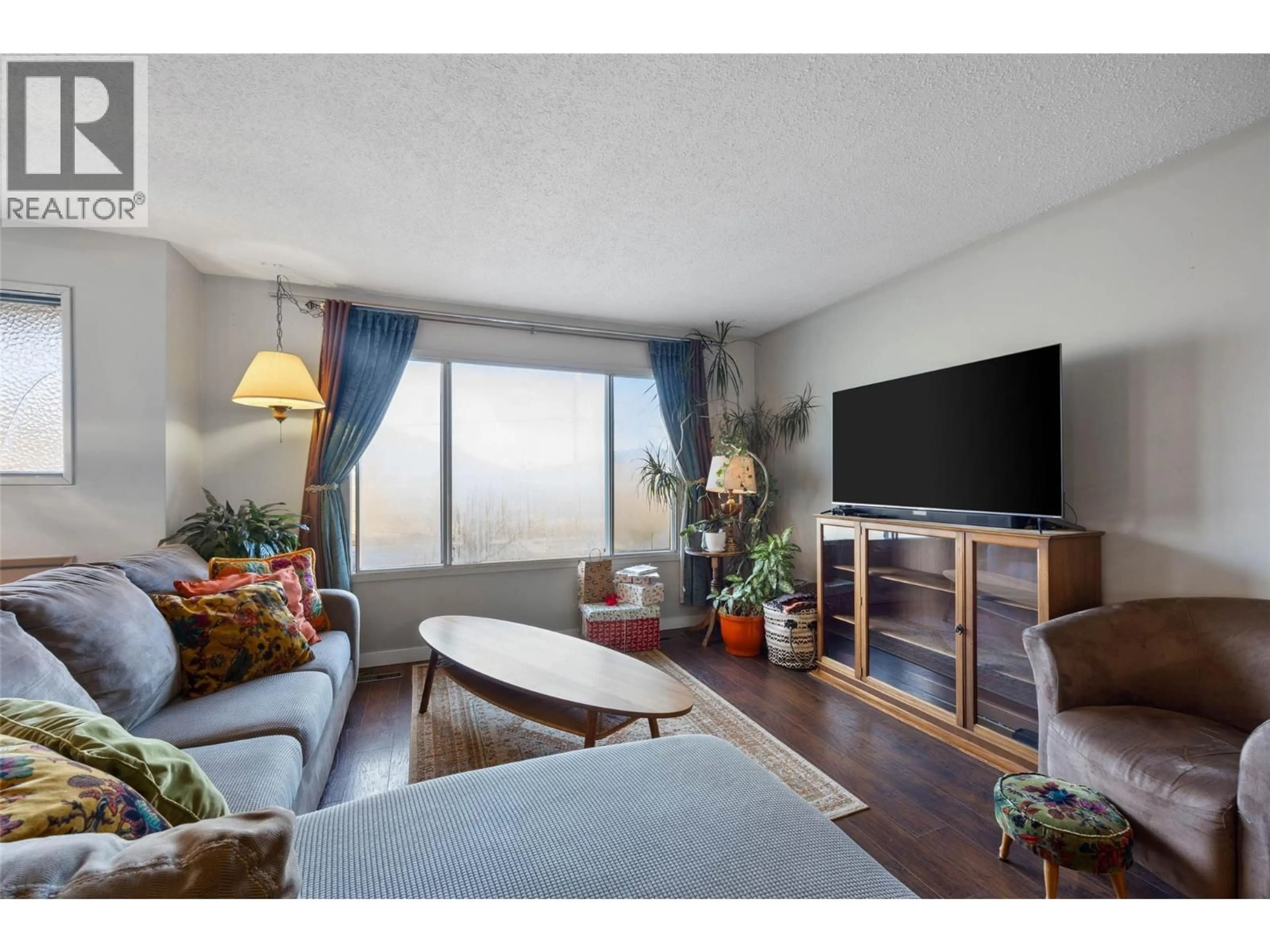 Living room with furniture, wood/laminate floor for 273 STATION ROAD, Kamloops British Columbia V0E1Z0