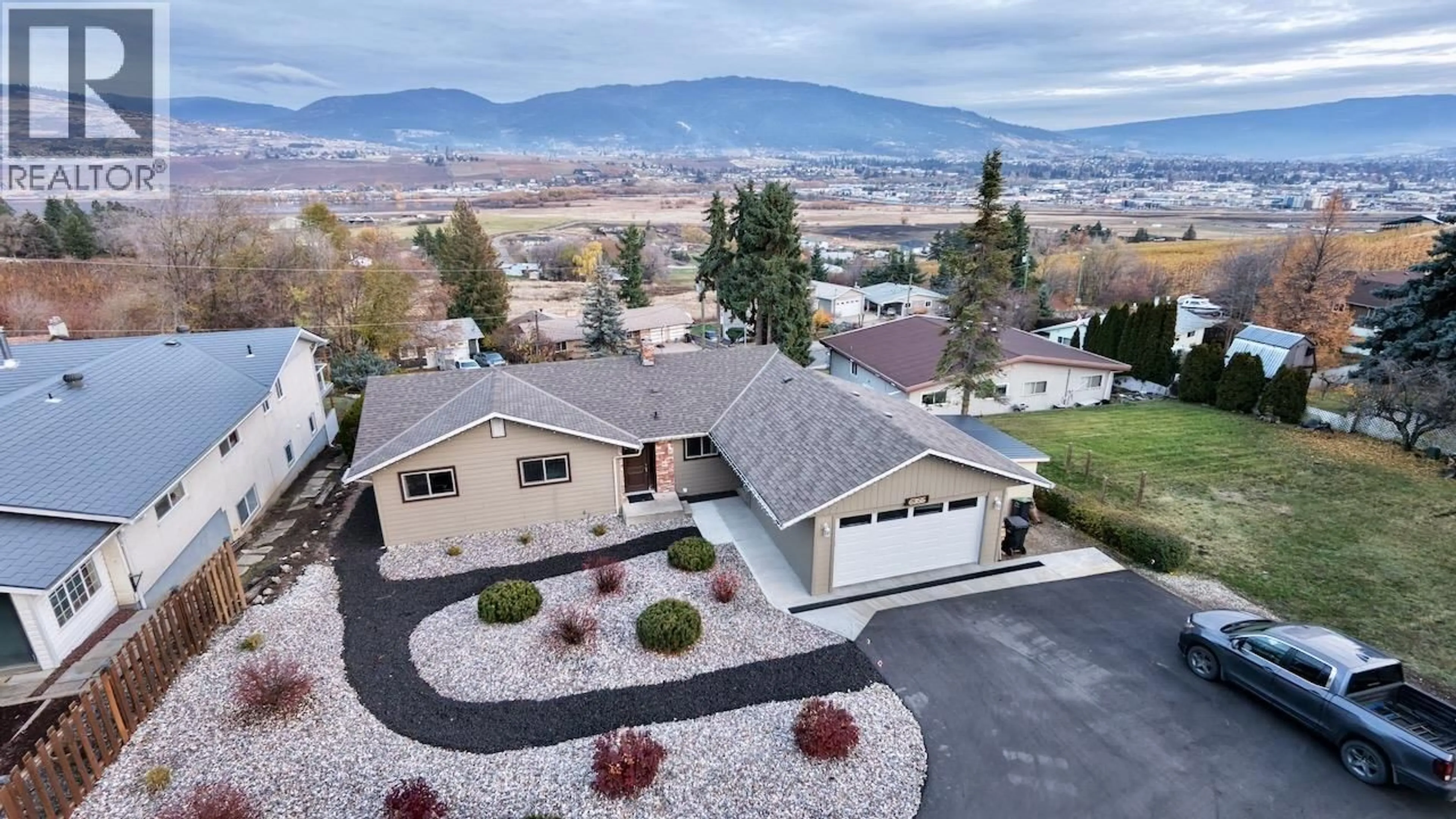 A pic from outside/outdoor area/front of a property/back of a property/a pic from drone, mountain view for 6355 CARDINAL ROAD, Vernon British Columbia V1H1W3