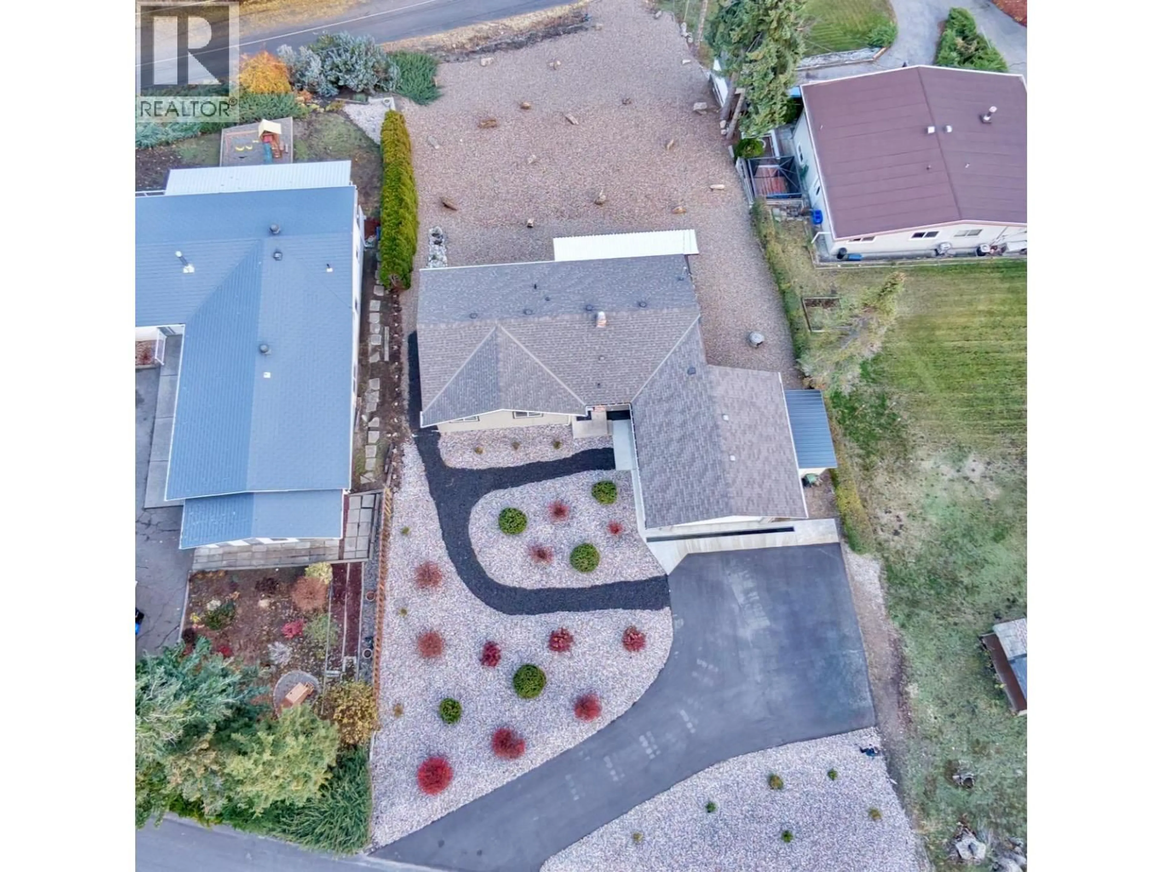 A pic from outside/outdoor area/front of a property/back of a property/a pic from drone, street for 6355 CARDINAL ROAD, Vernon British Columbia V1H1W3