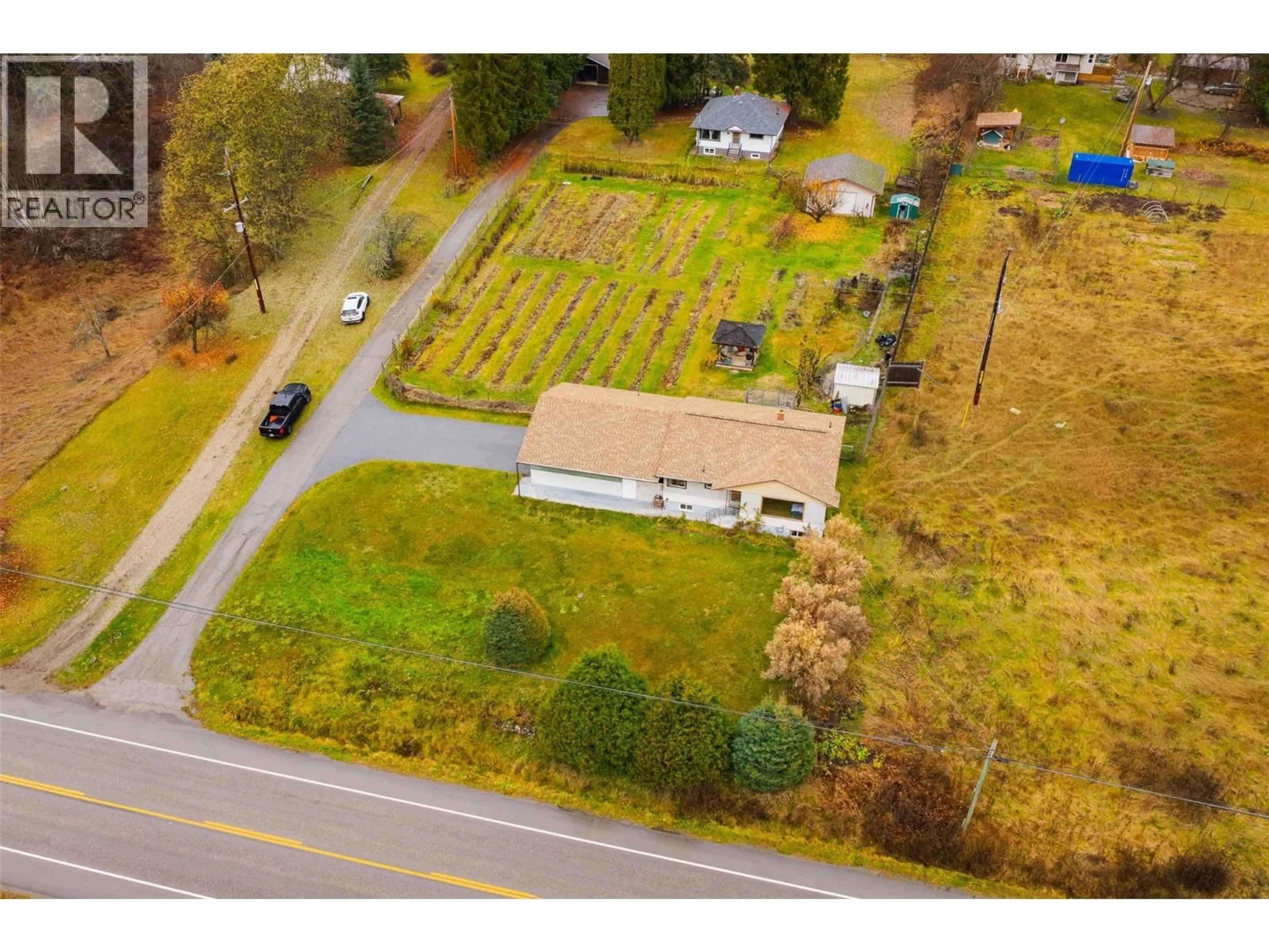 A pic from outside/outdoor area/front of a property/back of a property/a pic from drone, street for 1473 3A HIGHWAY, Castlegar British Columbia V1N4M7