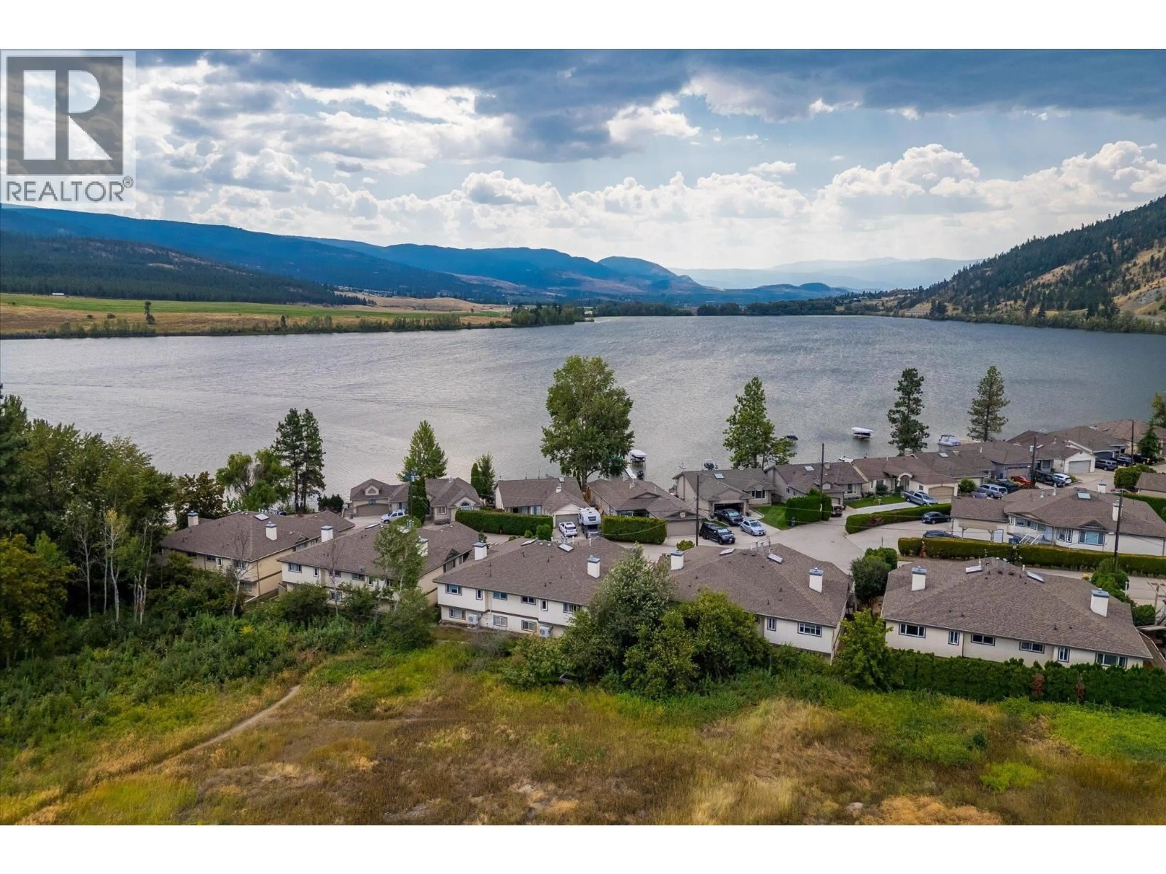 A pic from outside/outdoor area/front of a property/back of a property/a pic from drone, water/lake/river/ocean view for 109-4 - 7841 HIGHWAY 97 N OTHER, Kelowna British Columbia V1V1E4