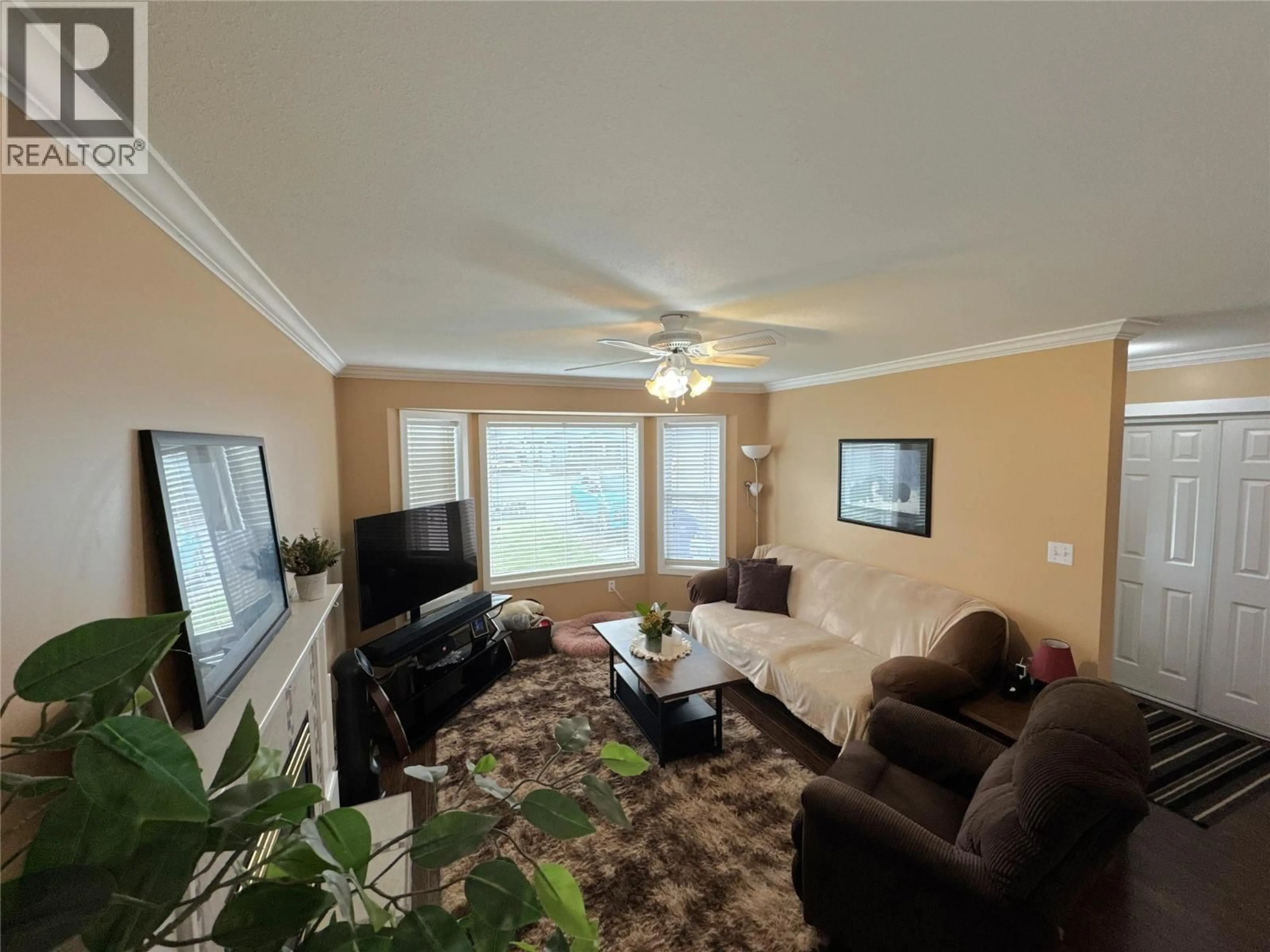 Living room with furniture, wood/laminate floor for 2313 CLAPPERTON AVENUE, Merritt British Columbia V1K1B8