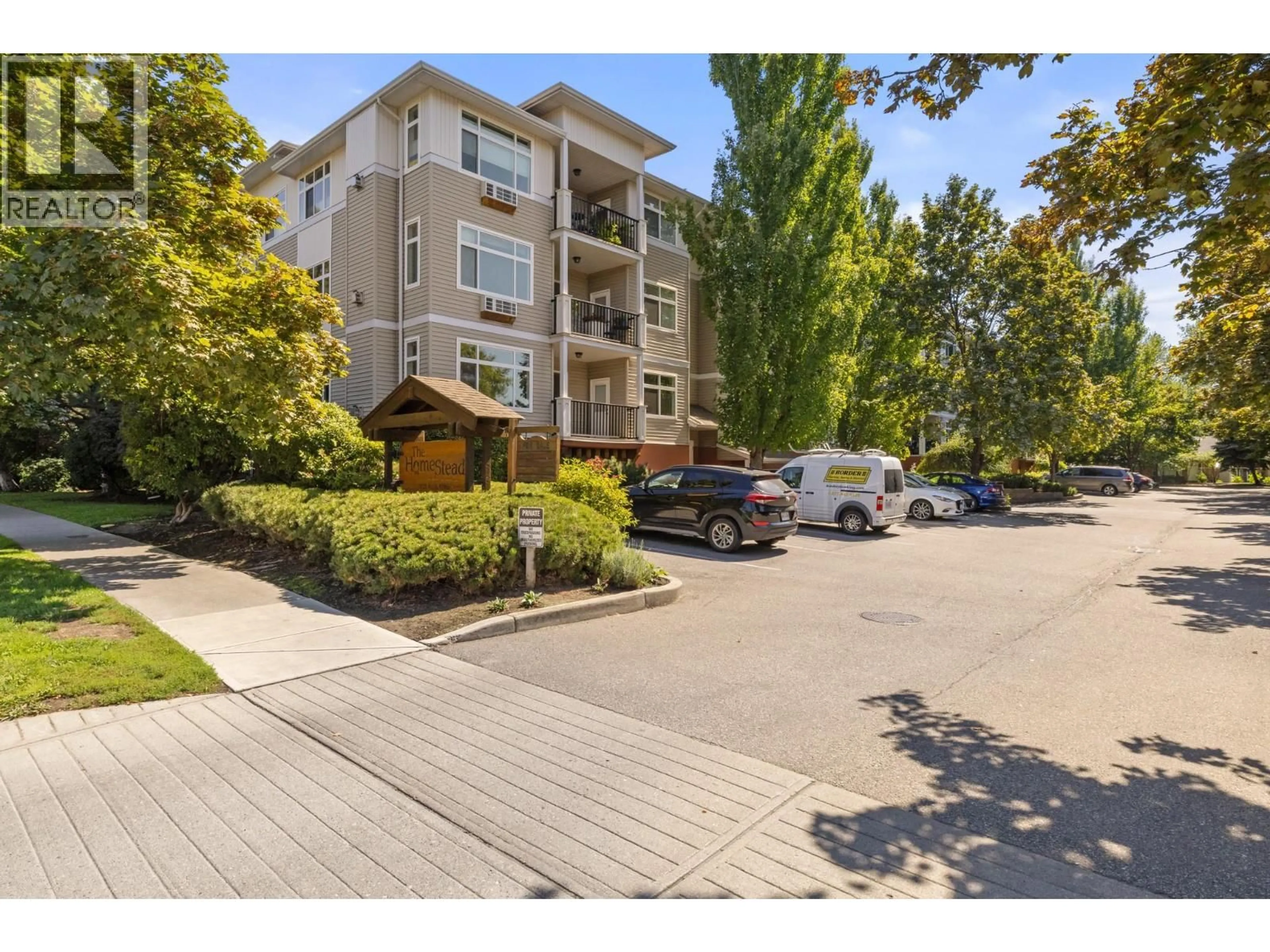 A pic from outside/outdoor area/front of a property/back of a property/a pic from drone, street for 206 - 1235 KLO ROAD, Kelowna British Columbia V1W3N7