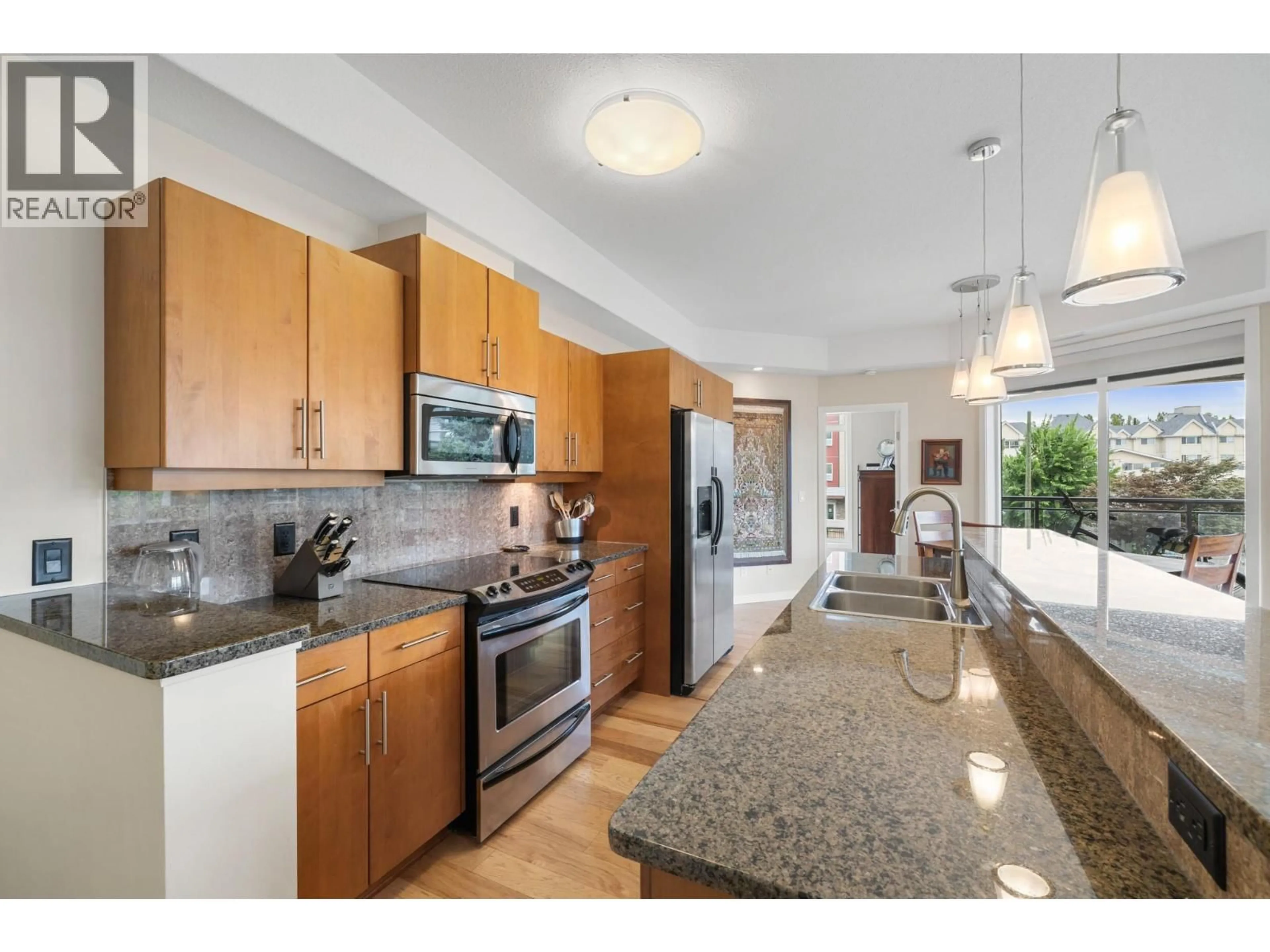 Open concept kitchen, ceramic/tile floor for 205 - 2011 AGASSIZ ROAD, Kelowna British Columbia V1Y9Z8