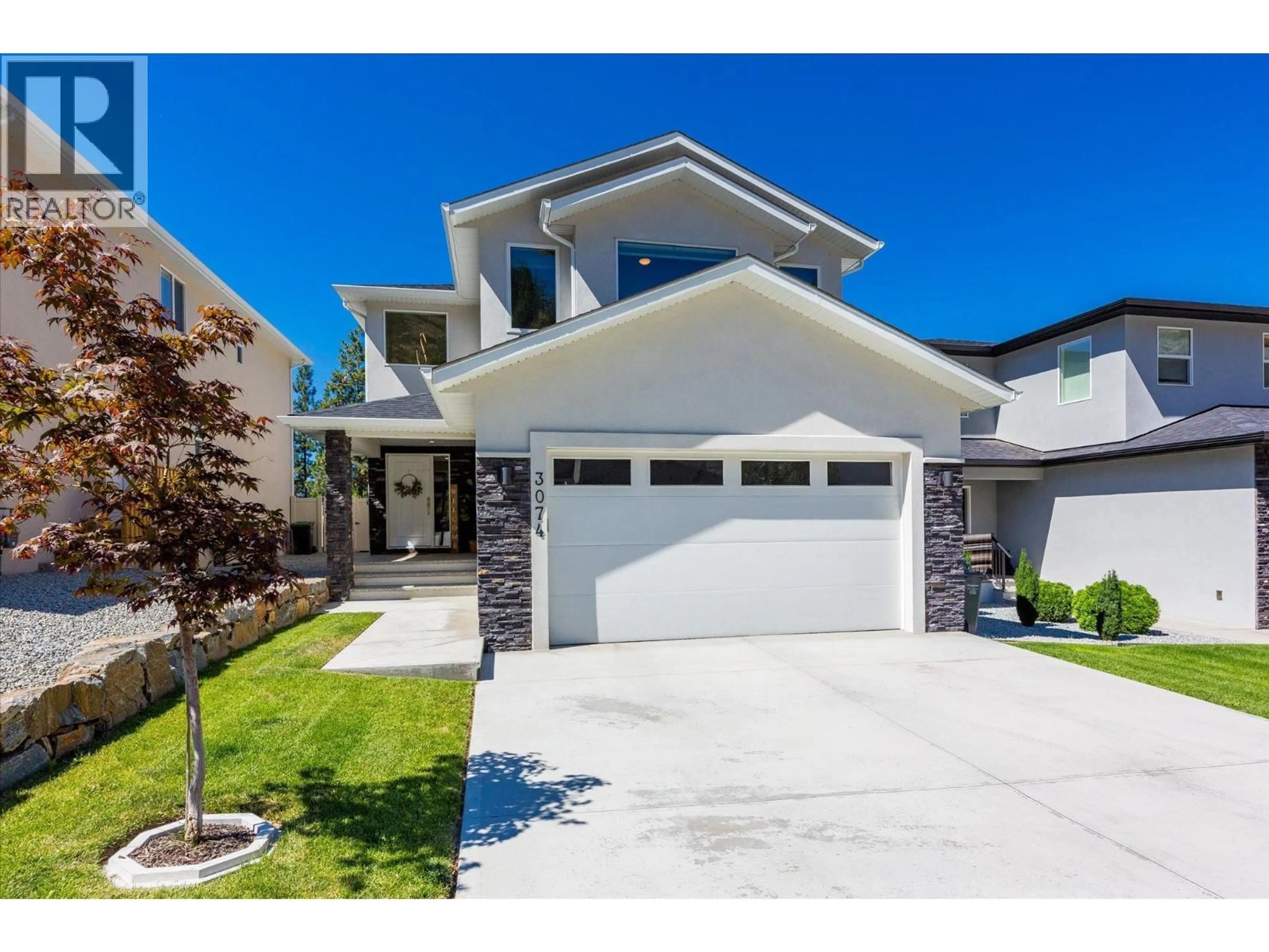 Home with vinyl exterior material, street for 3074 RIESLING WAY, West Kelowna British Columbia V4T0A5