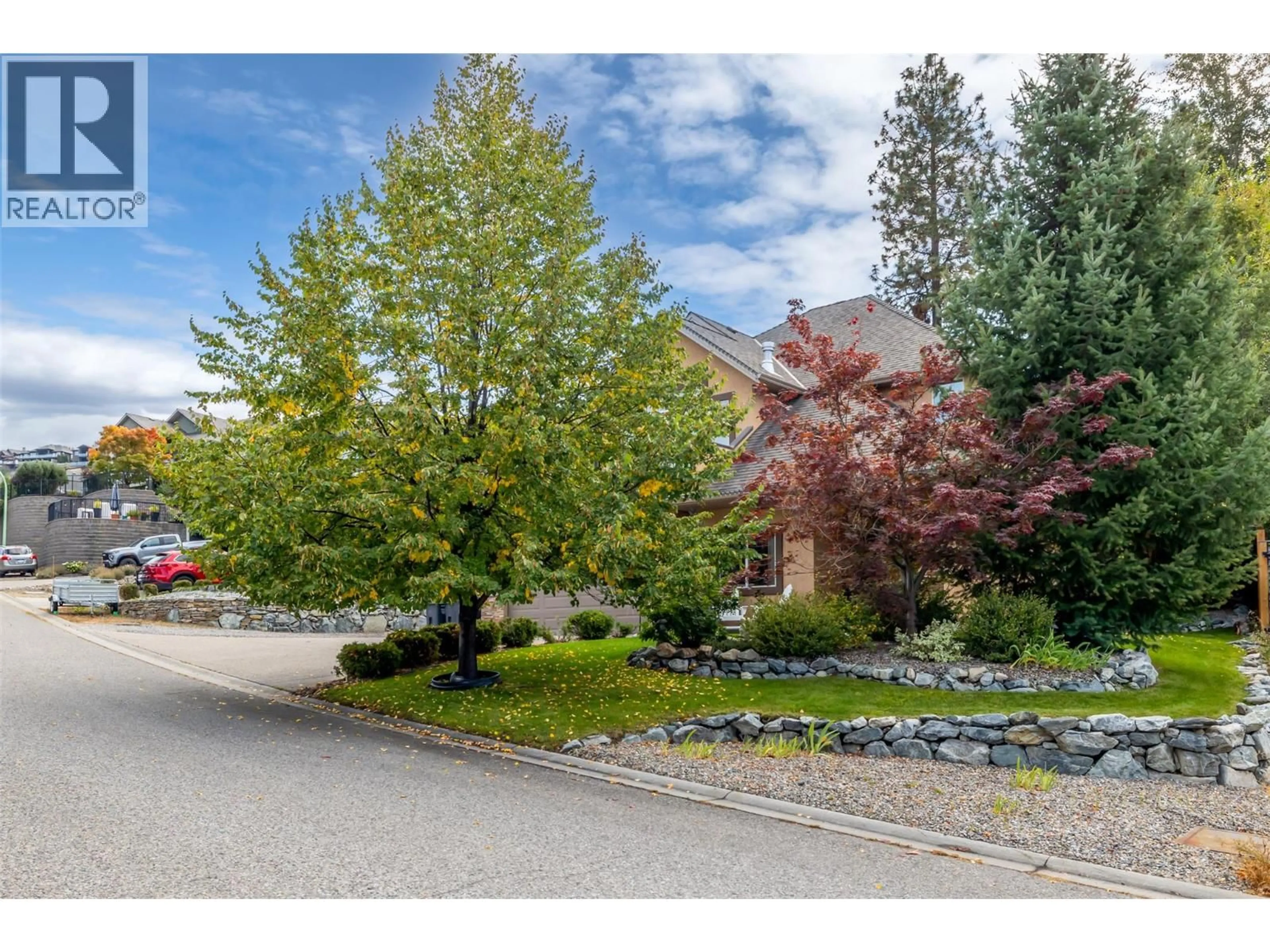 A pic from outside/outdoor area/front of a property/back of a property/a pic from drone, street for 5067 SEON CRESCENT, Kelowna British Columbia V1W5G8