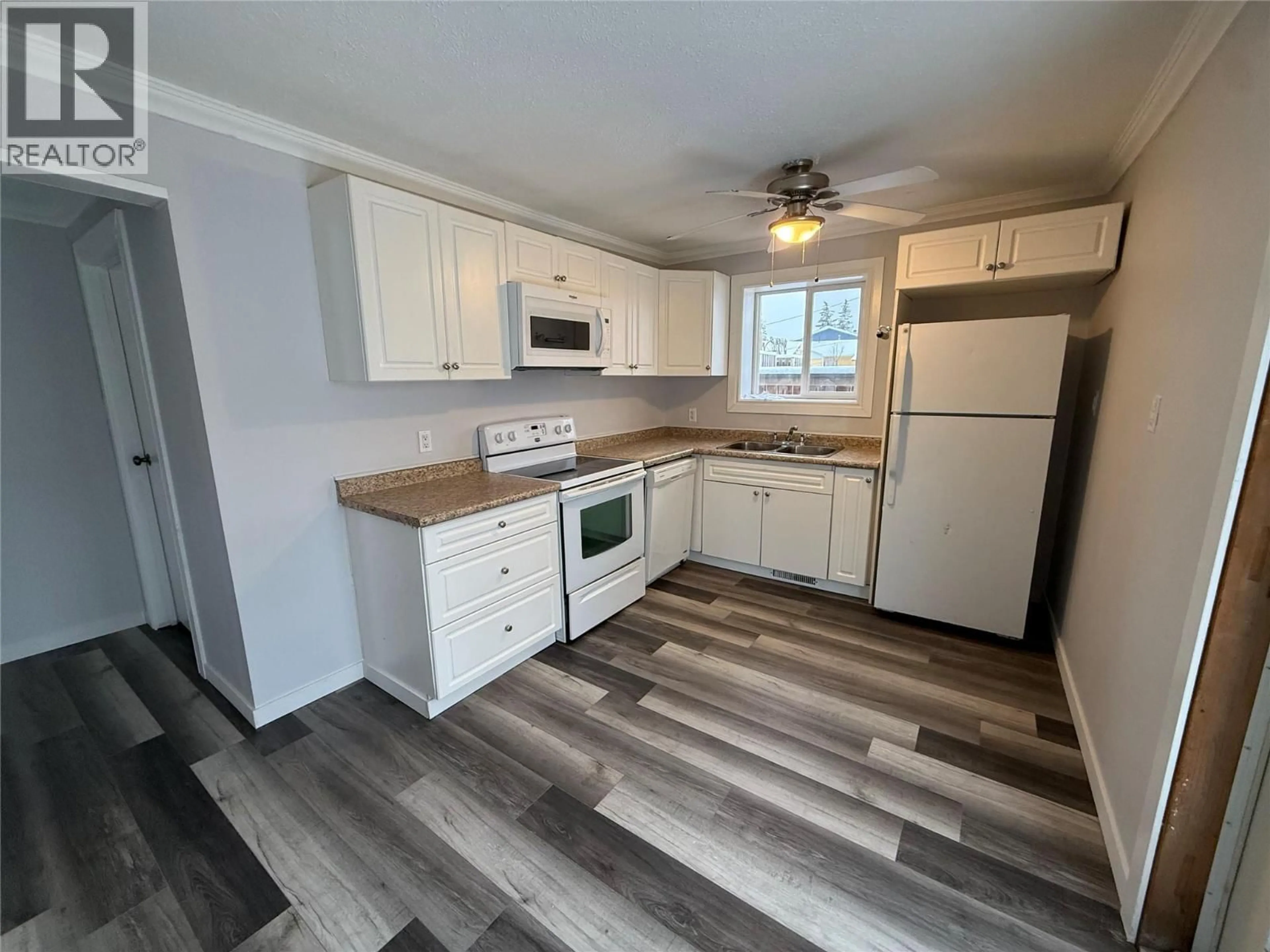 Standard kitchen, wood/laminate floor for 308 99 AVENUE, Dawson Creek British Columbia V1G1S9