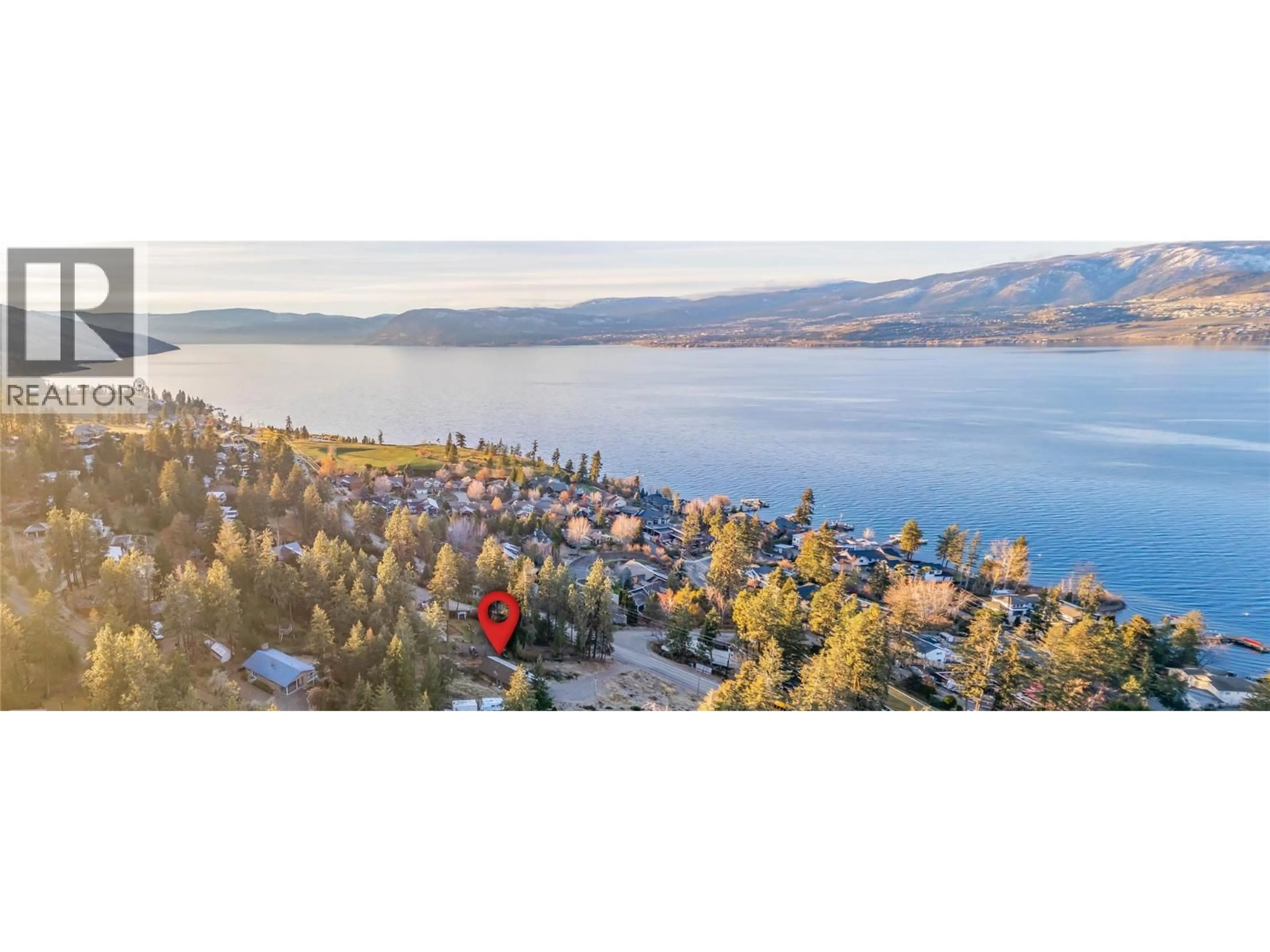 A pic from outside/outdoor area/front of a property/back of a property/a pic from drone, water/lake/river/ocean view for 5127 LAKESHORE ROAD, Kelowna British Columbia V1W4J1