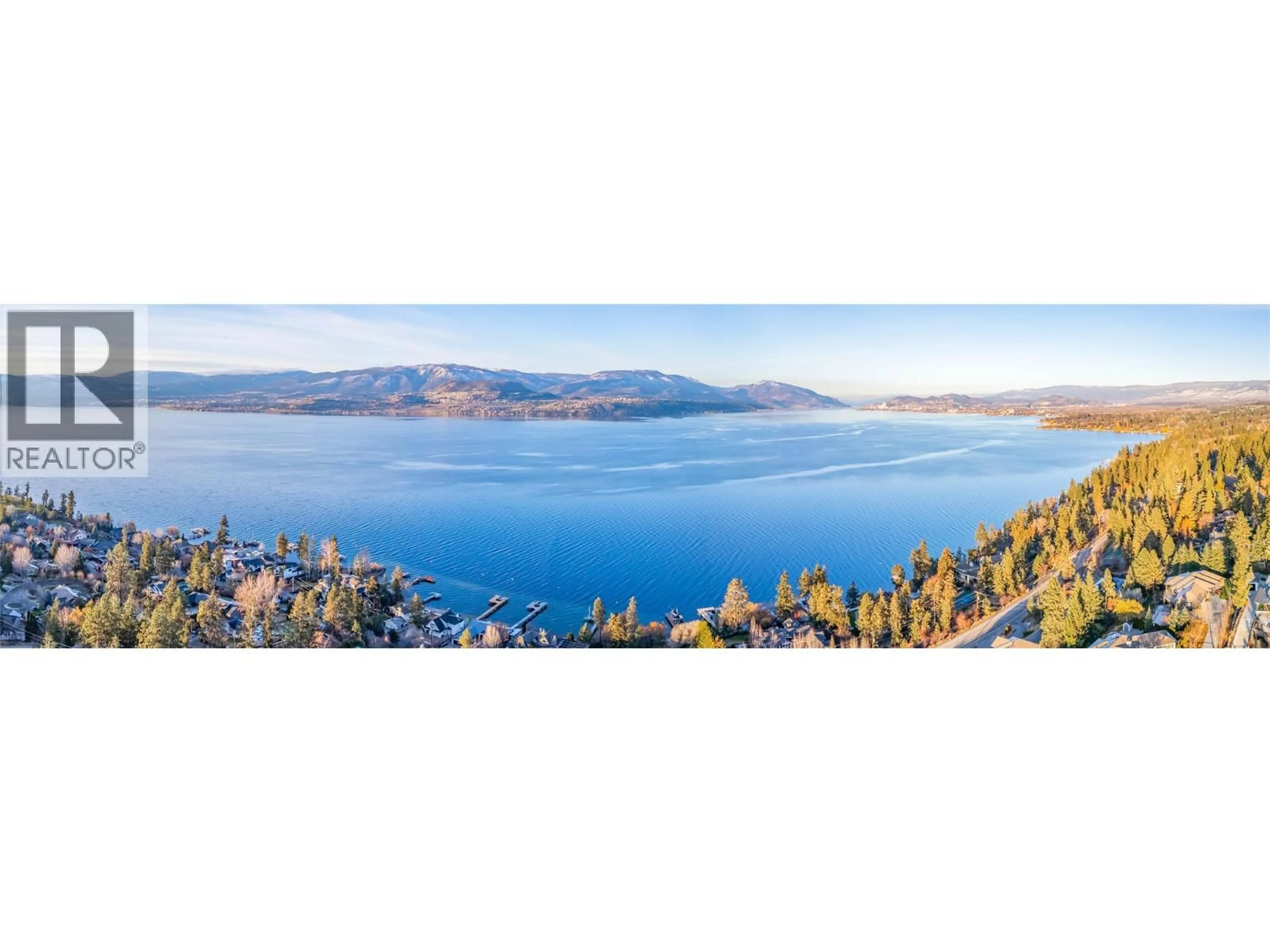 A pic from outside/outdoor area/front of a property/back of a property/a pic from drone, water/lake/river/ocean view for 5127 LAKESHORE ROAD, Kelowna British Columbia V1W4J1