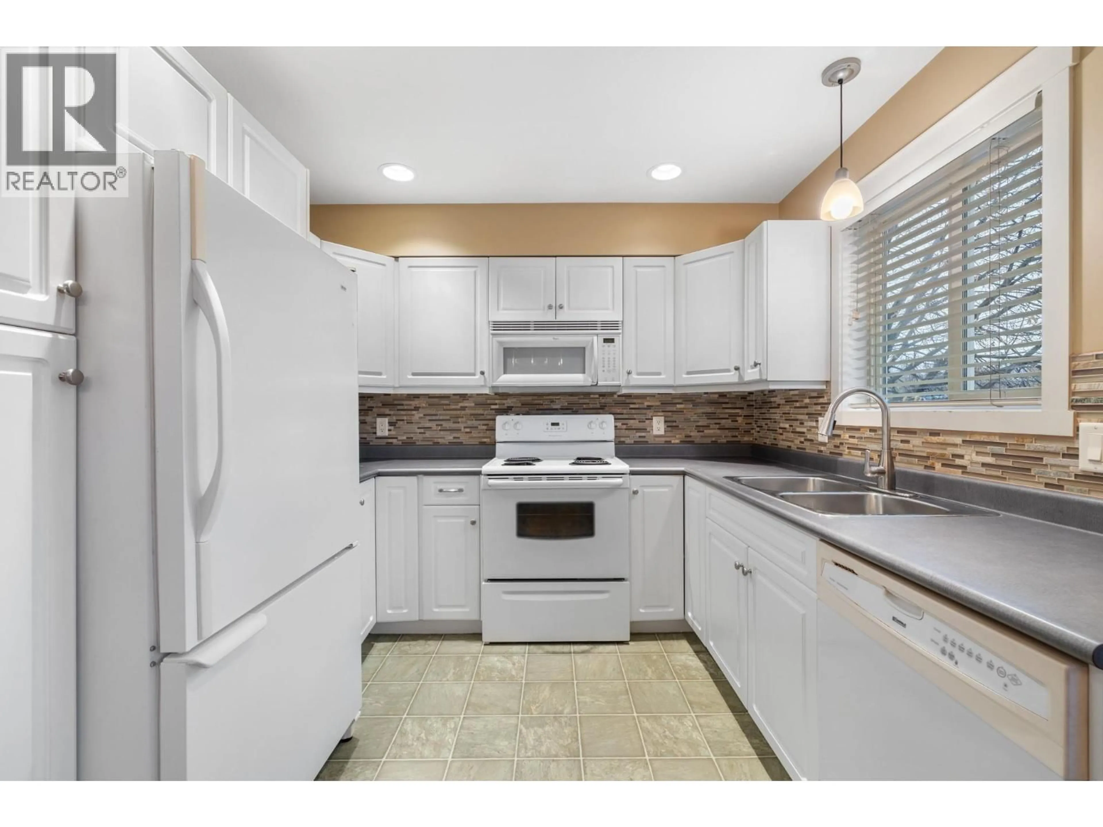 Standard kitchen, ceramic/tile floor for 6 - 124 MILLS ROAD, Kelowna British Columbia V1X4G7