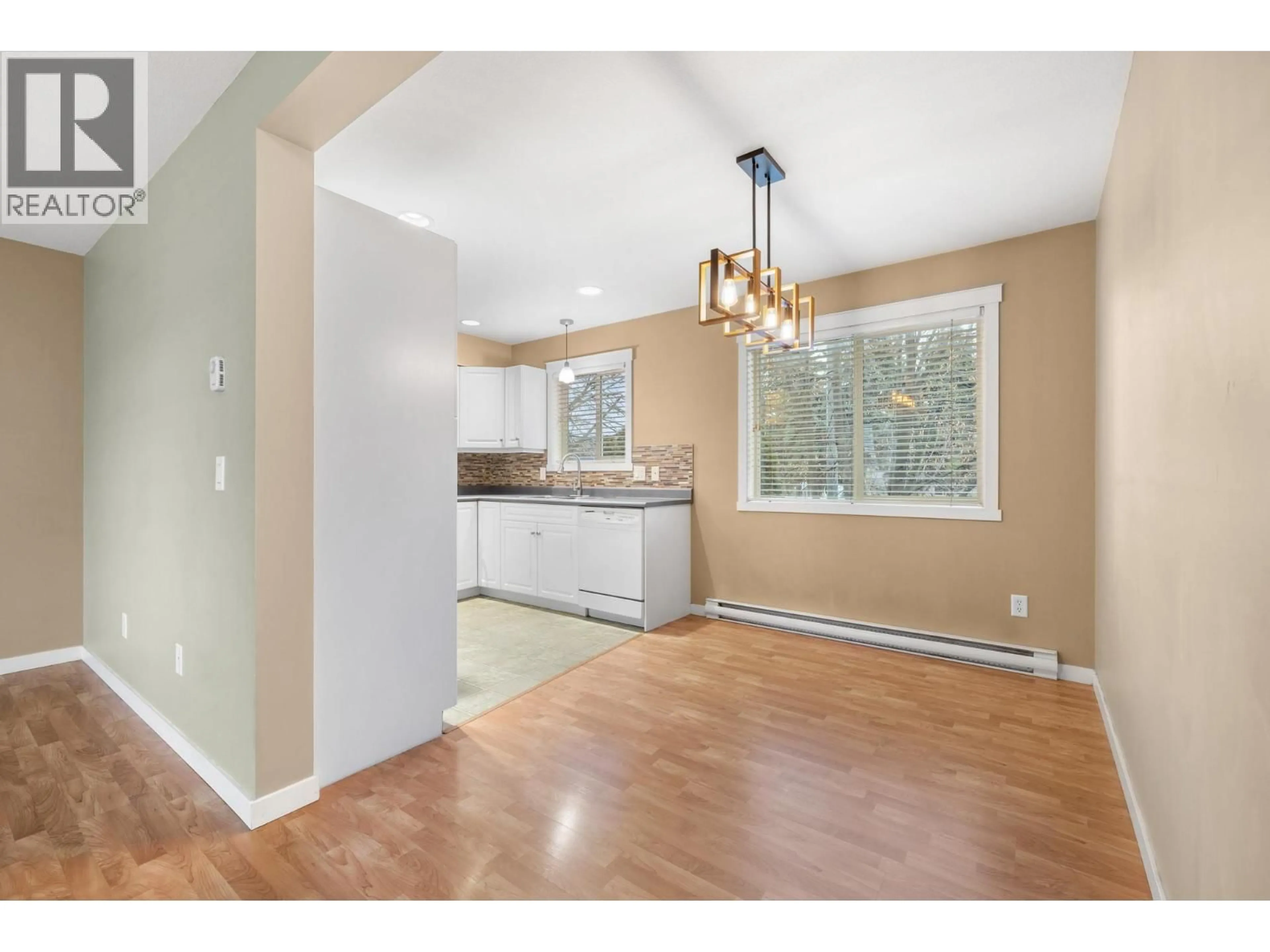 Open concept kitchen, wood/laminate floor for 6 - 124 MILLS ROAD, Kelowna British Columbia V1X4G7