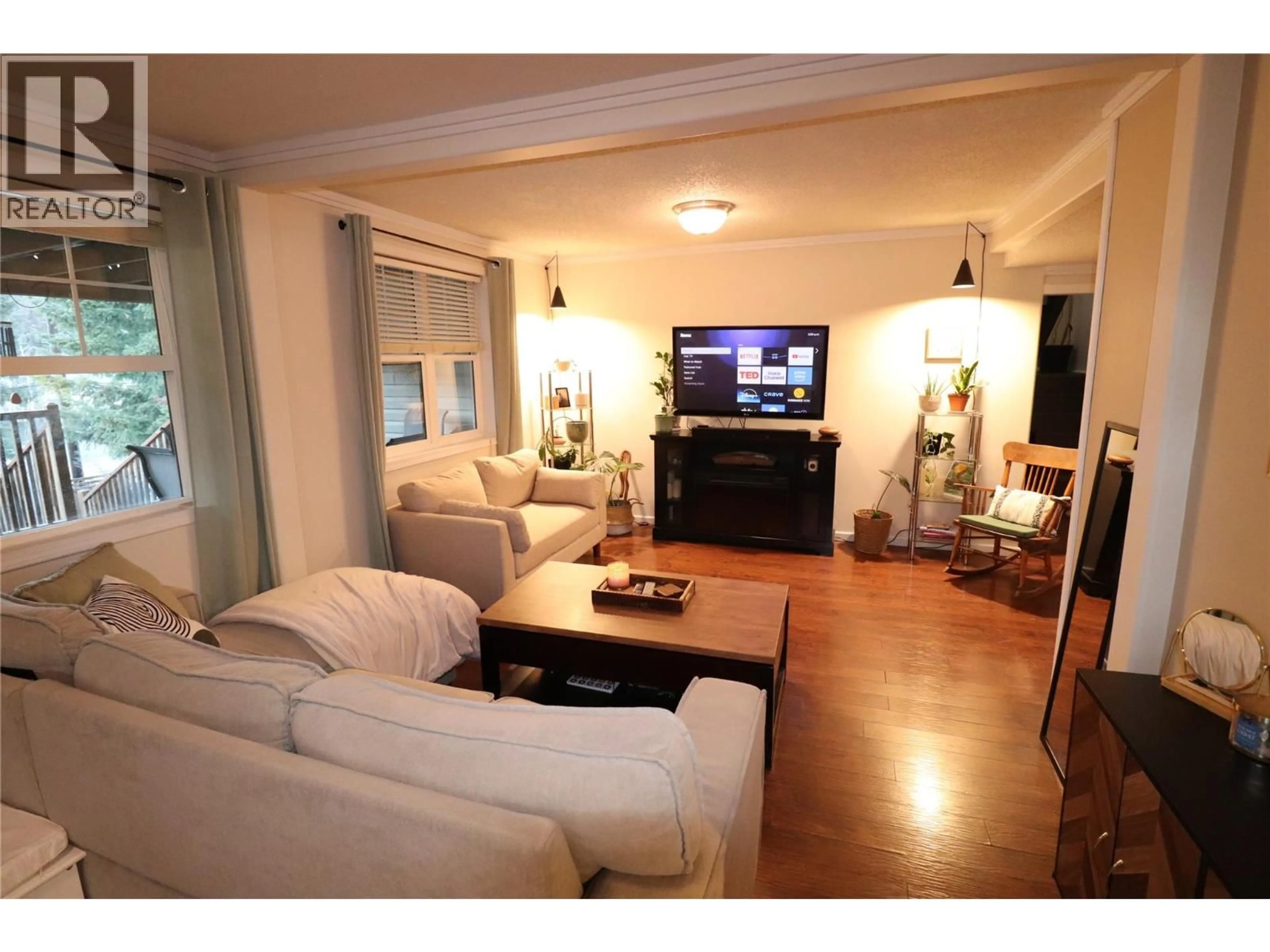 Living room with furniture, wood/laminate floor for 613 11TH AVENUE, Castlegar British Columbia V1N1J7