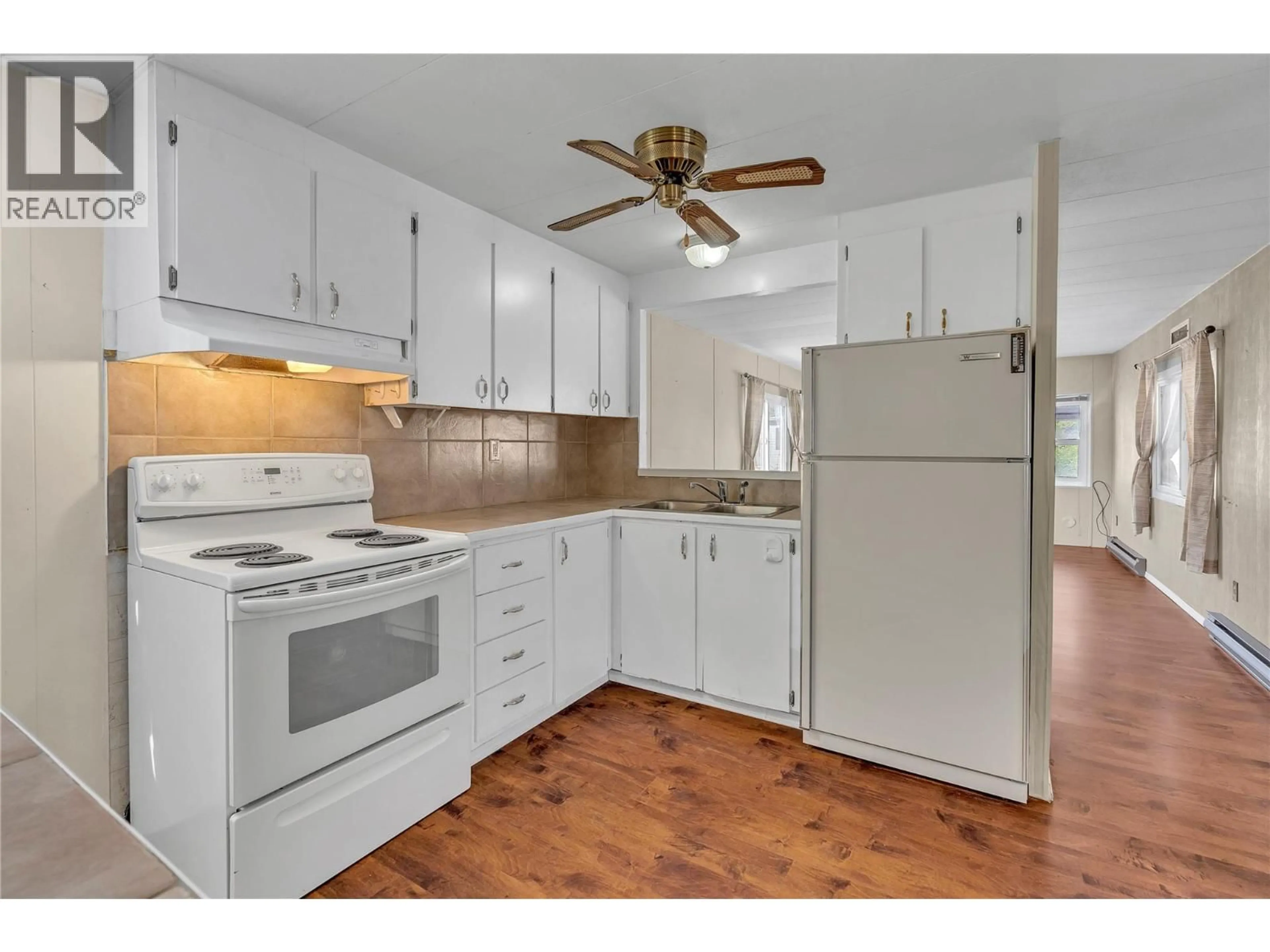 Standard kitchen, wood/laminate floor for 101 - 98 OKANAGAN AVENUE EAST, Penticton British Columbia V2A3J5