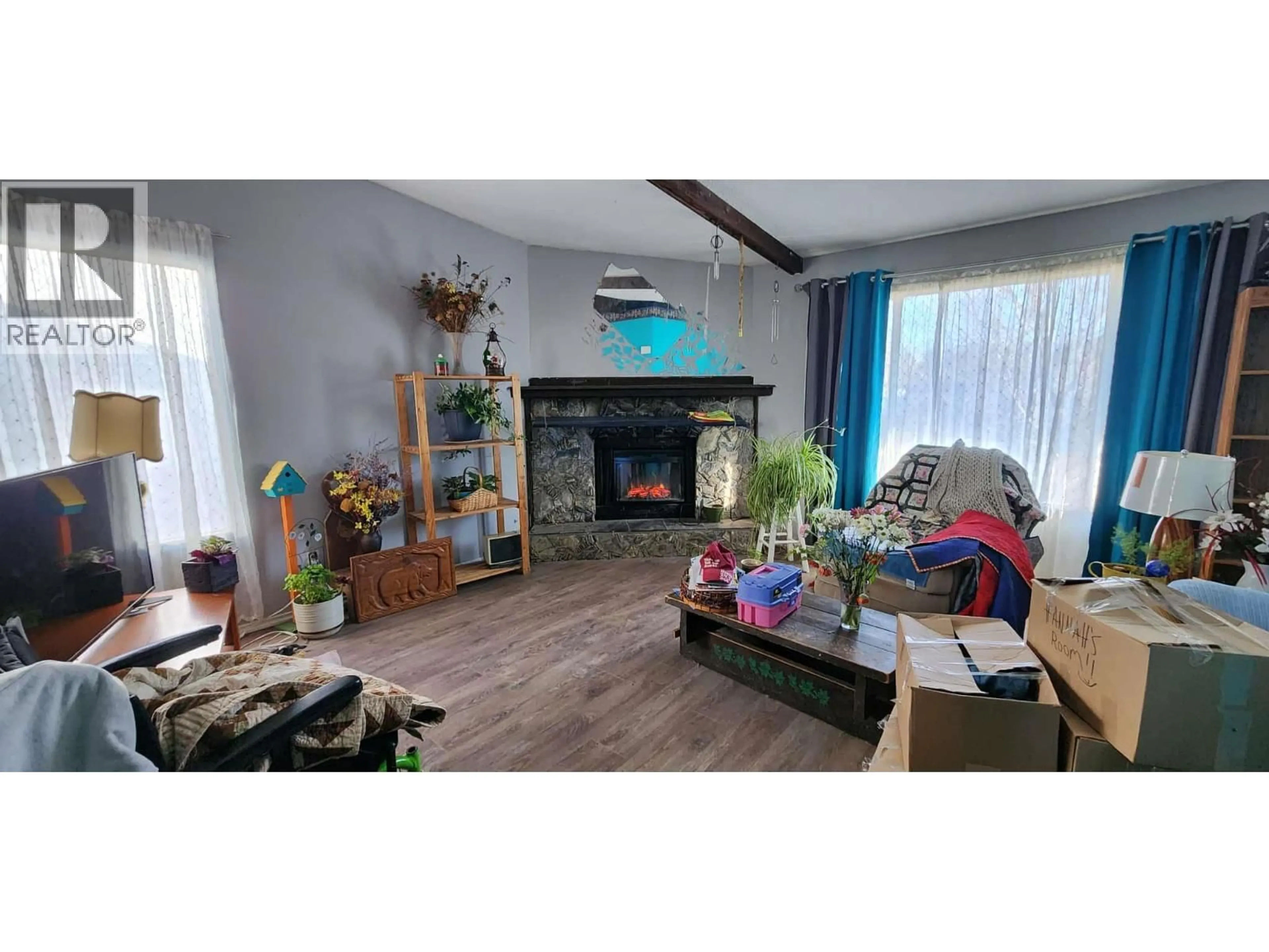 Living room with furniture, wood/laminate floor for 804 FRASER ROAD, Lumby British Columbia V0E2G7