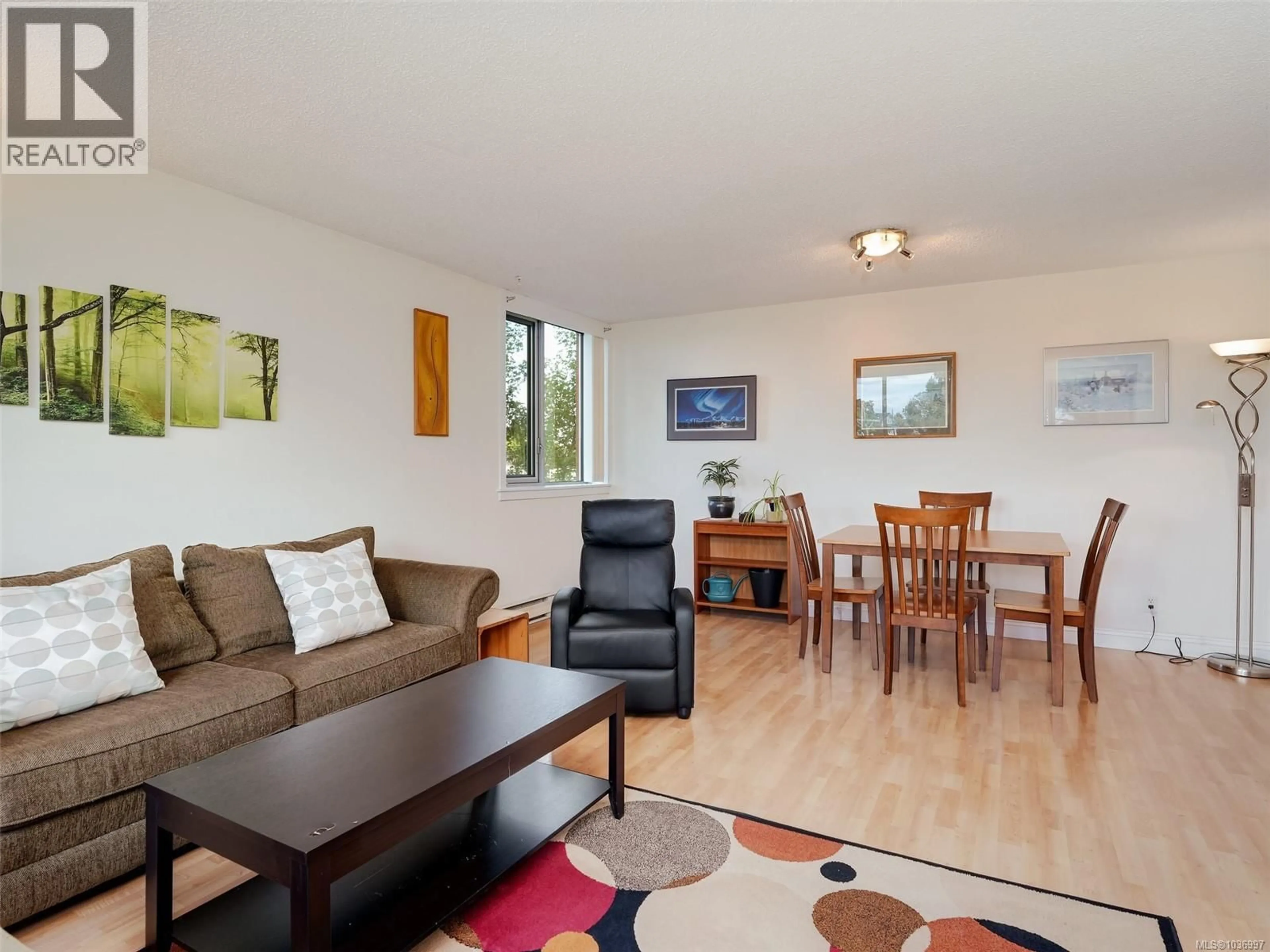Living room with furniture, wood/laminate floor for 501 - 327 MAITLAND STREET, Victoria British Columbia V9A7G7
