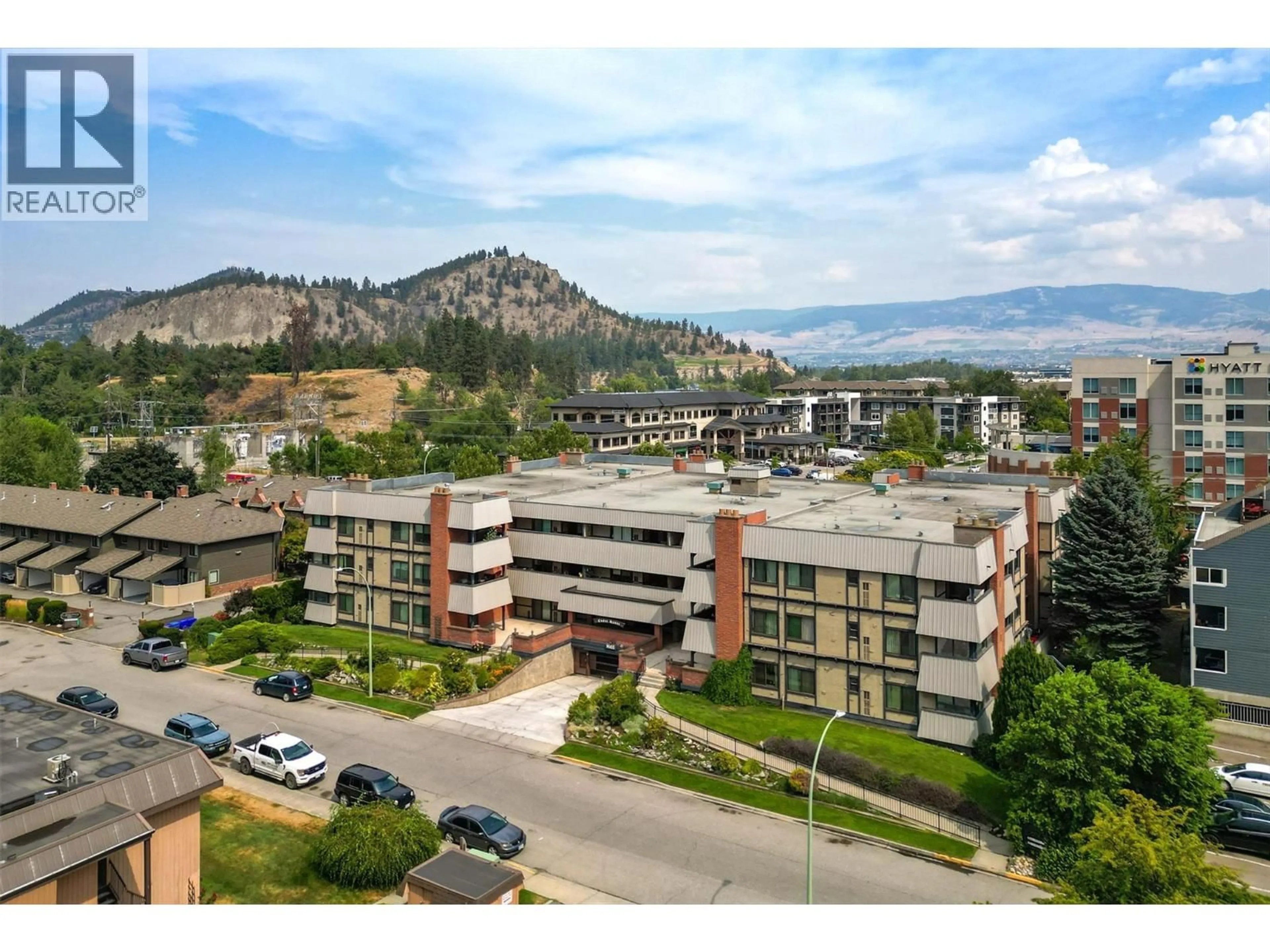 A pic from outside/outdoor area/front of a property/back of a property/a pic from drone, mountain view for 333 - 1665 UFTON COURT, Kelowna British Columbia V1Y8G7