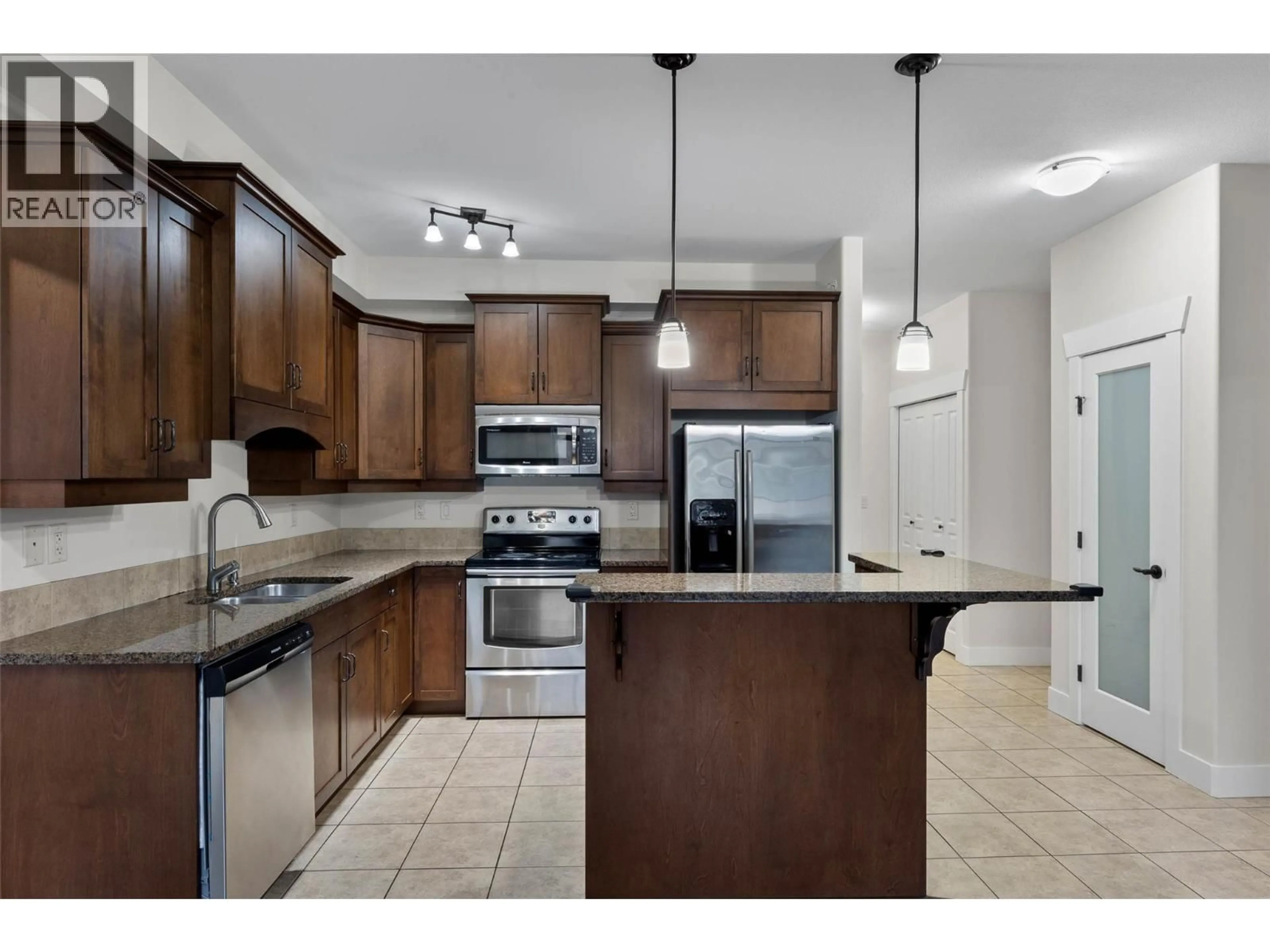 Open concept kitchen, ceramic/tile floor for 412 - 795 MCGILL ROAD, Kamloops British Columbia V2C0B9