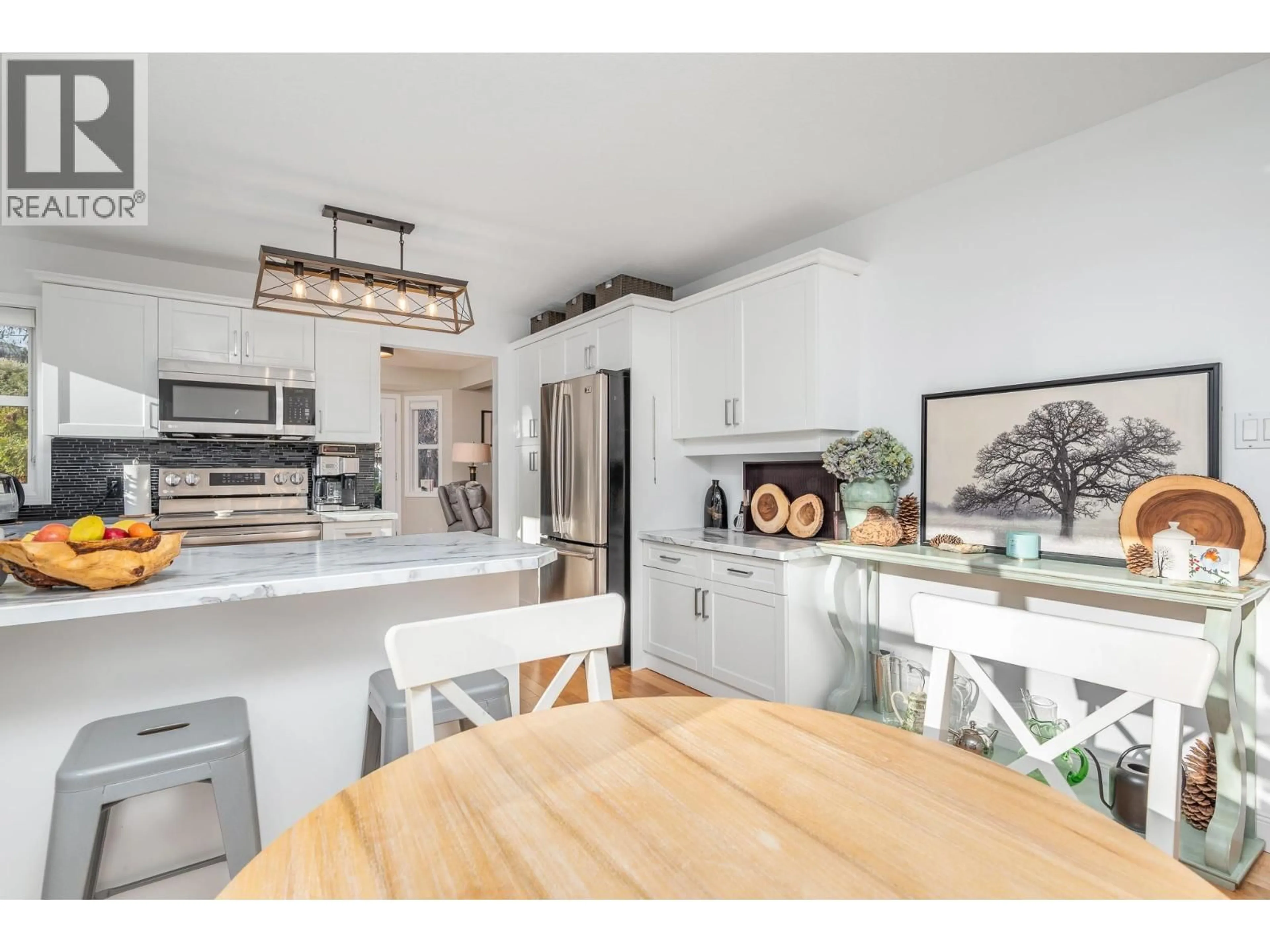 Open concept kitchen, wood/laminate floor for 9 - 401 BROWNE ROAD, Vernon British Columbia V1T7M2