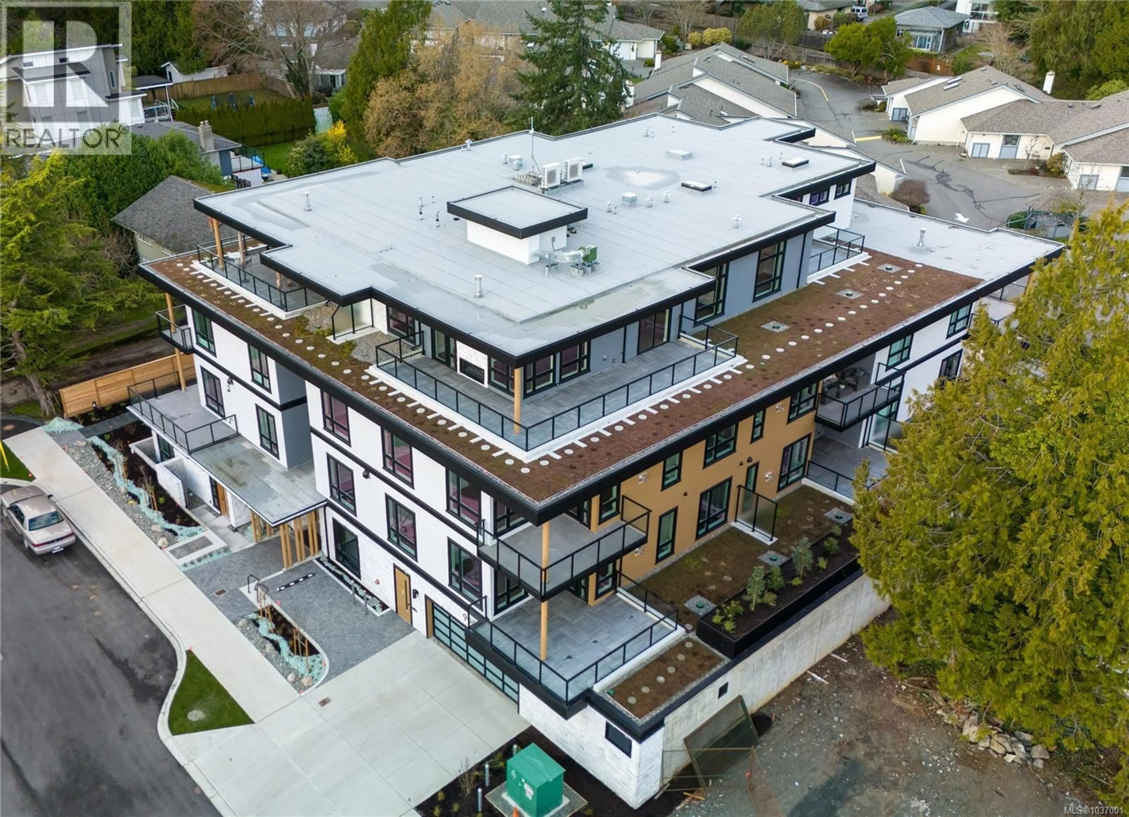 A pic from outside/outdoor area/front of a property/back of a property/a pic from drone, building for 303 - 990 DOUMAC AVENUE, Saanich British Columbia V8Y1M4